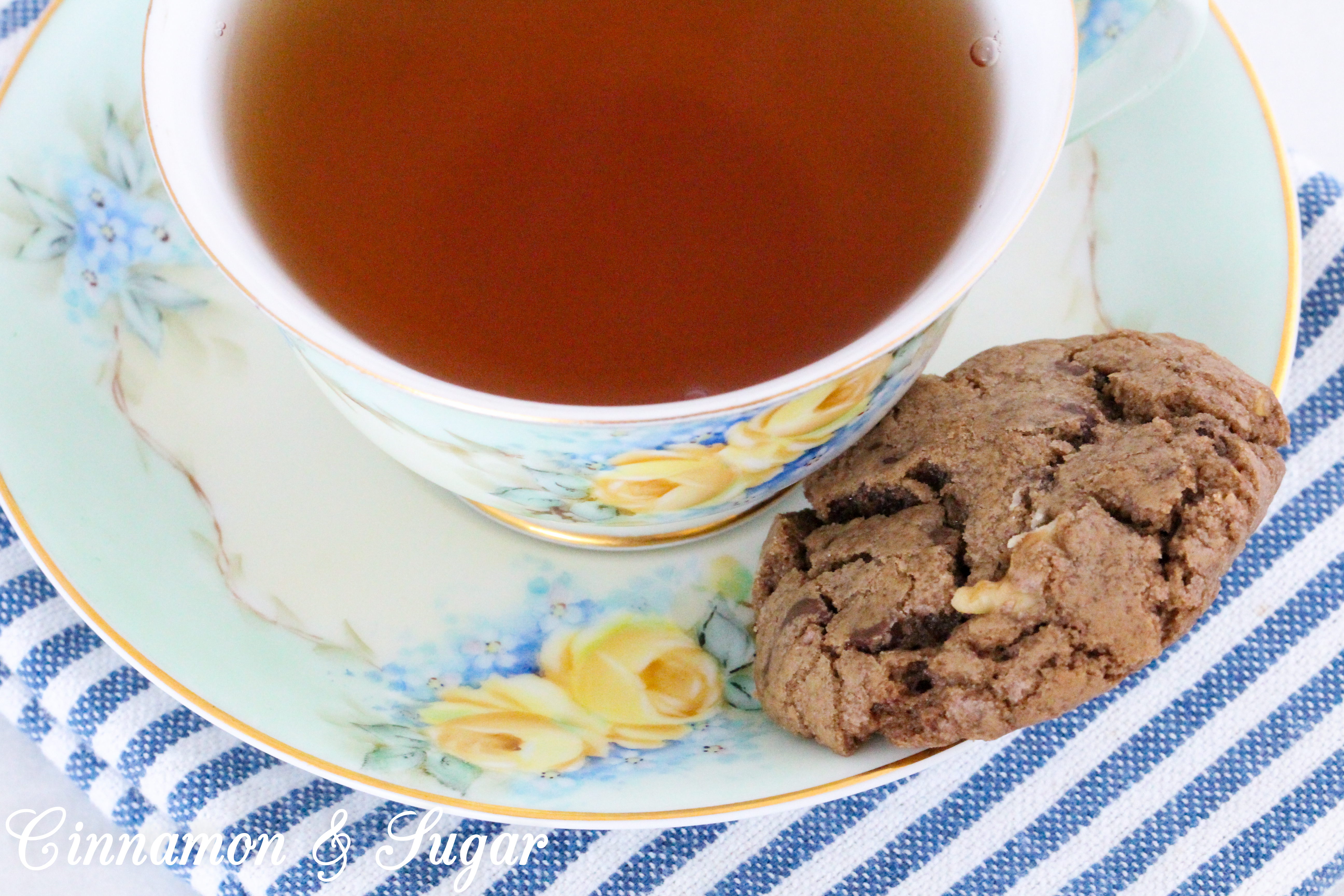 Chocolate Walnut Cookies are the perfect combination of chewy and crunchy, thanks to the melted chocolate, chocolate chips, and walnuts. Recipe shared with permission granted by Debra Sennefelder, author of Three Widows and a Corpse.