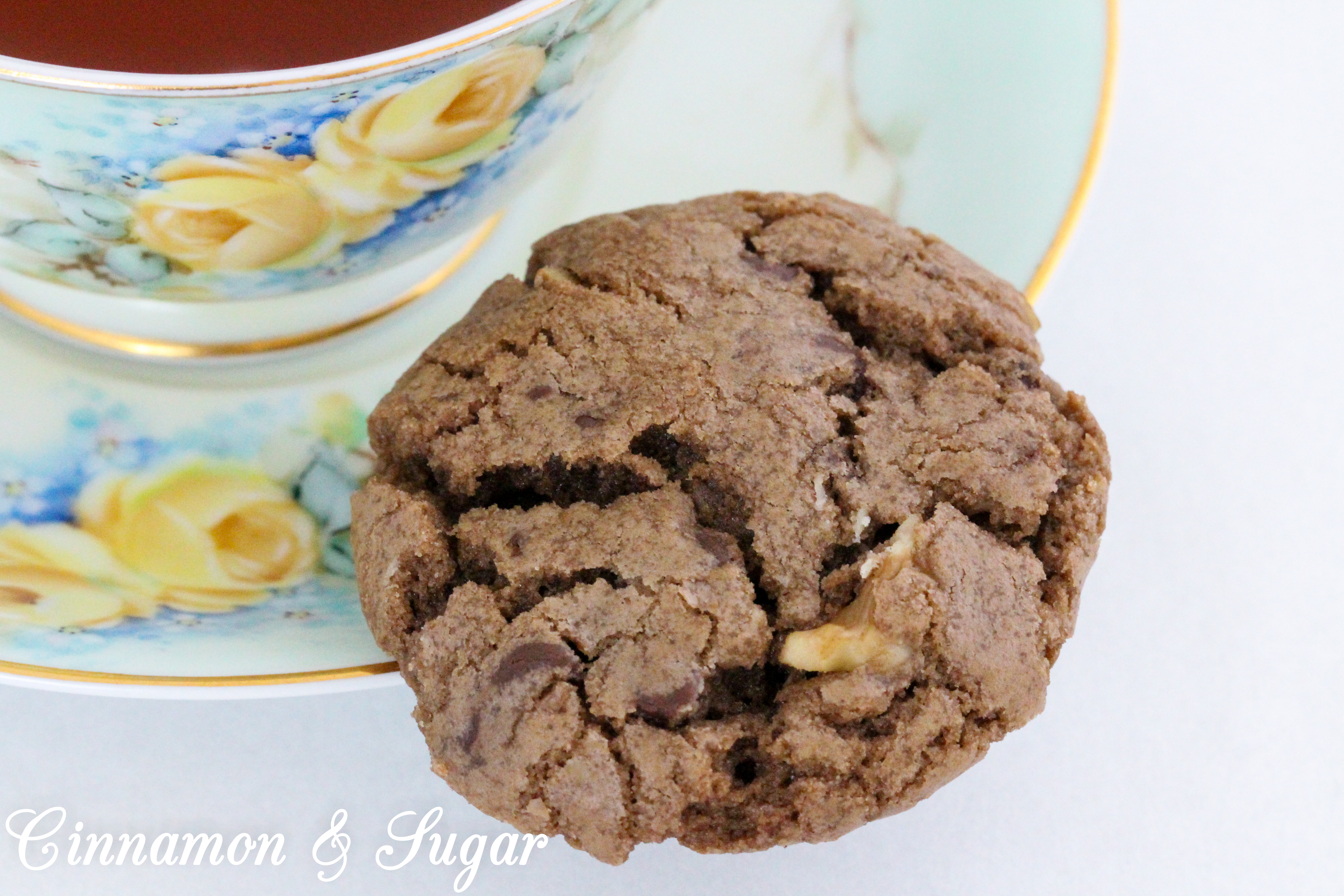 Chocolate Walnut Cookies are the perfect combination of chewy and crunchy, thanks to the melted chocolate, chocolate chips, and walnuts. Recipe shared with permission granted by Debra Sennefelder, author of Three Widows and a Corpse.