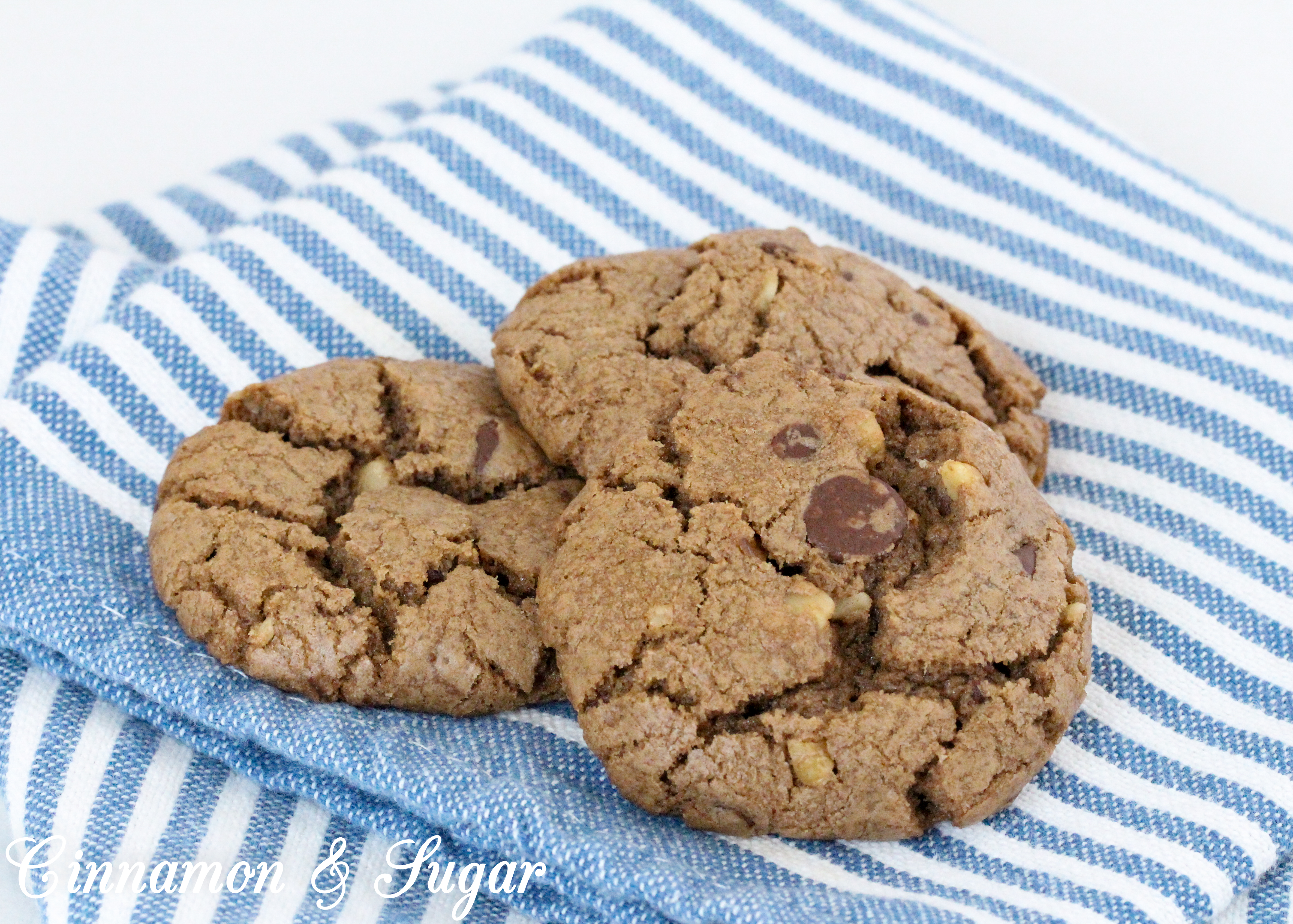 Chocolate Walnut Cookies are the perfect combination of chewy and crunchy, thanks to the melted chocolate, chocolate chips, and walnuts. Recipe shared with permission granted by Debra Sennefelder, author of Three Widows and a Corpse.