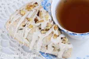 Maple Walnut Scones are ultra-rich and flaky while walnuts and maple glaze adds extra layers of flavors and textures making these a family favorite. Recipe from Karen MacInerney, author of SCONE COLD DEAD.