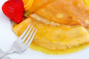 Crêpes Suzette are a few staple ingredients whisked together and paired with a few simple ingredients simmered together, creating a scrumptious treat Recipe shared with permission granted by Maya Corrigan, author of CRYPT SUZETTE.