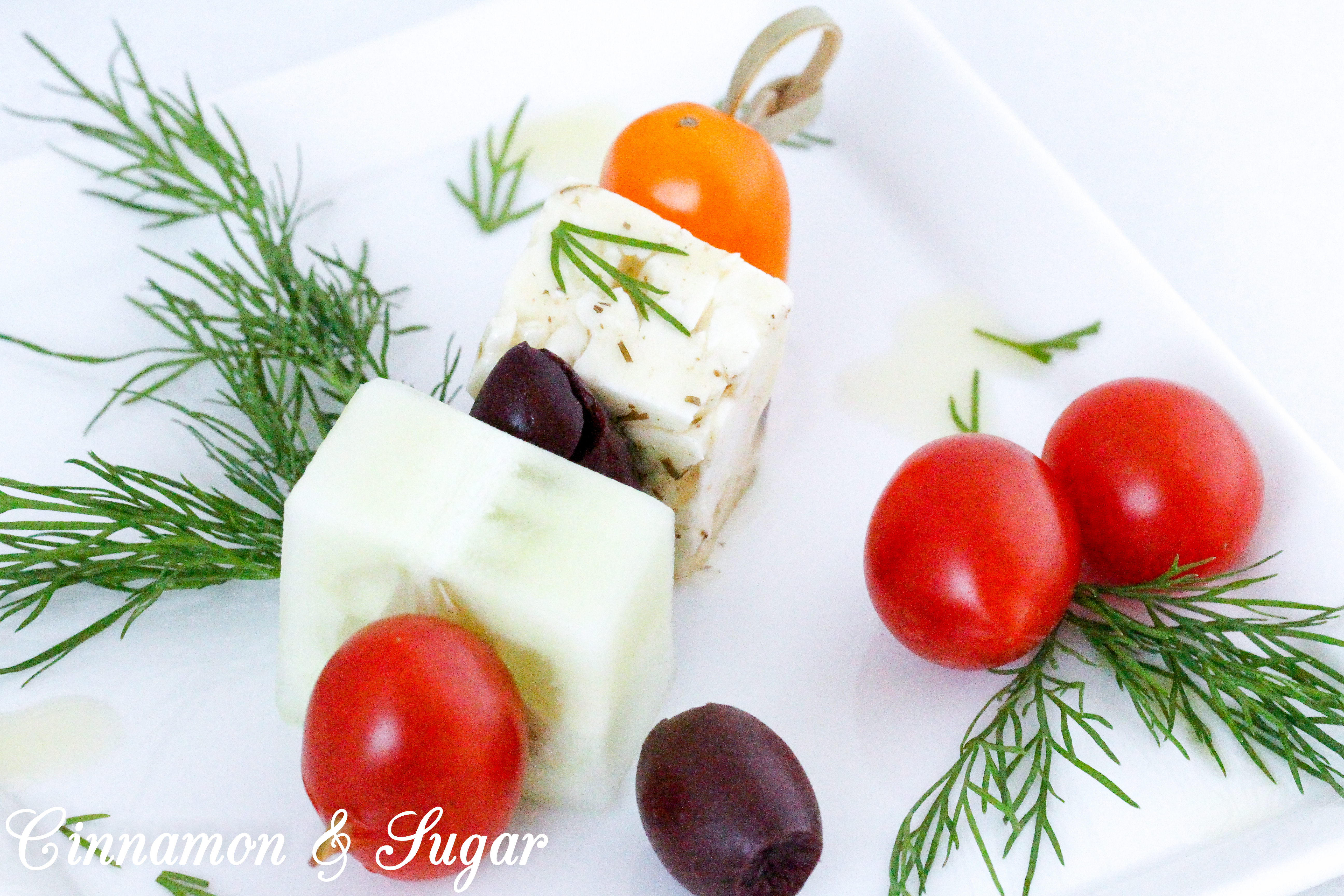 Light and refreshing, Greek Salad Skewers are mini appetizers that are quick to make and provide a fun, healthy way to satisfy pre-dinner appetites. Recipe shared with permission granted by Jenn McKinlay, author of WORD TO THE WISE.