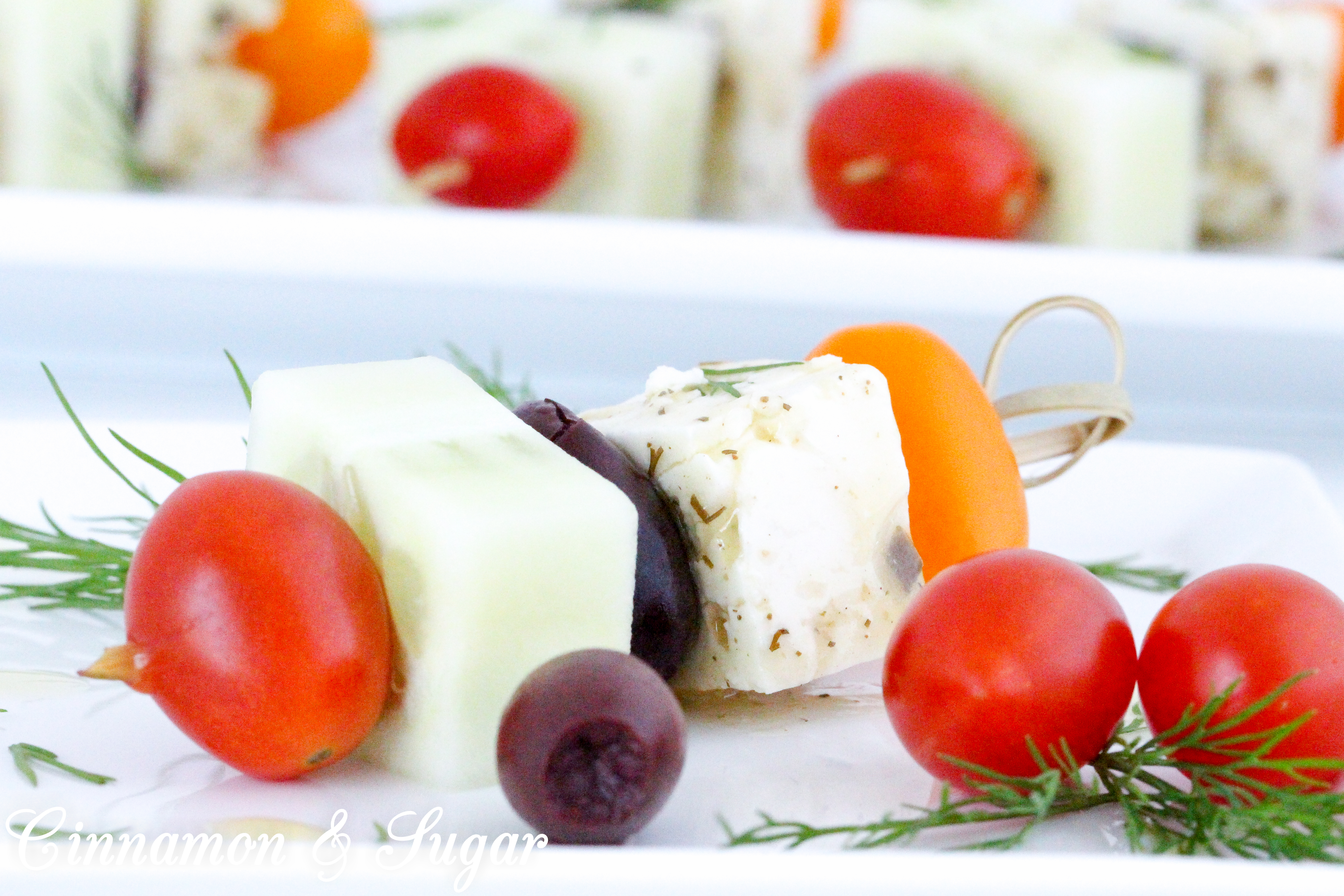 Light and refreshing, Greek Salad Skewers are mini appetizers that are quick to make and provide a fun, healthy way to satisfy pre-dinner appetites. Recipe shared with permission granted by Jenn McKinlay, author of WORD TO THE WISE.