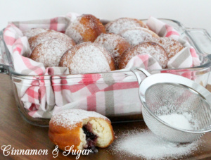 Jelly-filled donuts are yeasty deep-fried treats, stuffed with fruity jam and dusted with confectioner's sugar. Perfect for breakfast and coffee breaks! Recipe shared with permission granted by Ginger Bolton, author of Jealousy Filled Donuts.