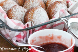 Jelly-filled donuts are yeasty deep-fried treats, stuffed with fruity jam and dusted with confectioner's sugar. Perfect for breakfast and coffee breaks! Recipe shared with permission granted by Ginger Bolton, author of Jealousy Filled Donuts.