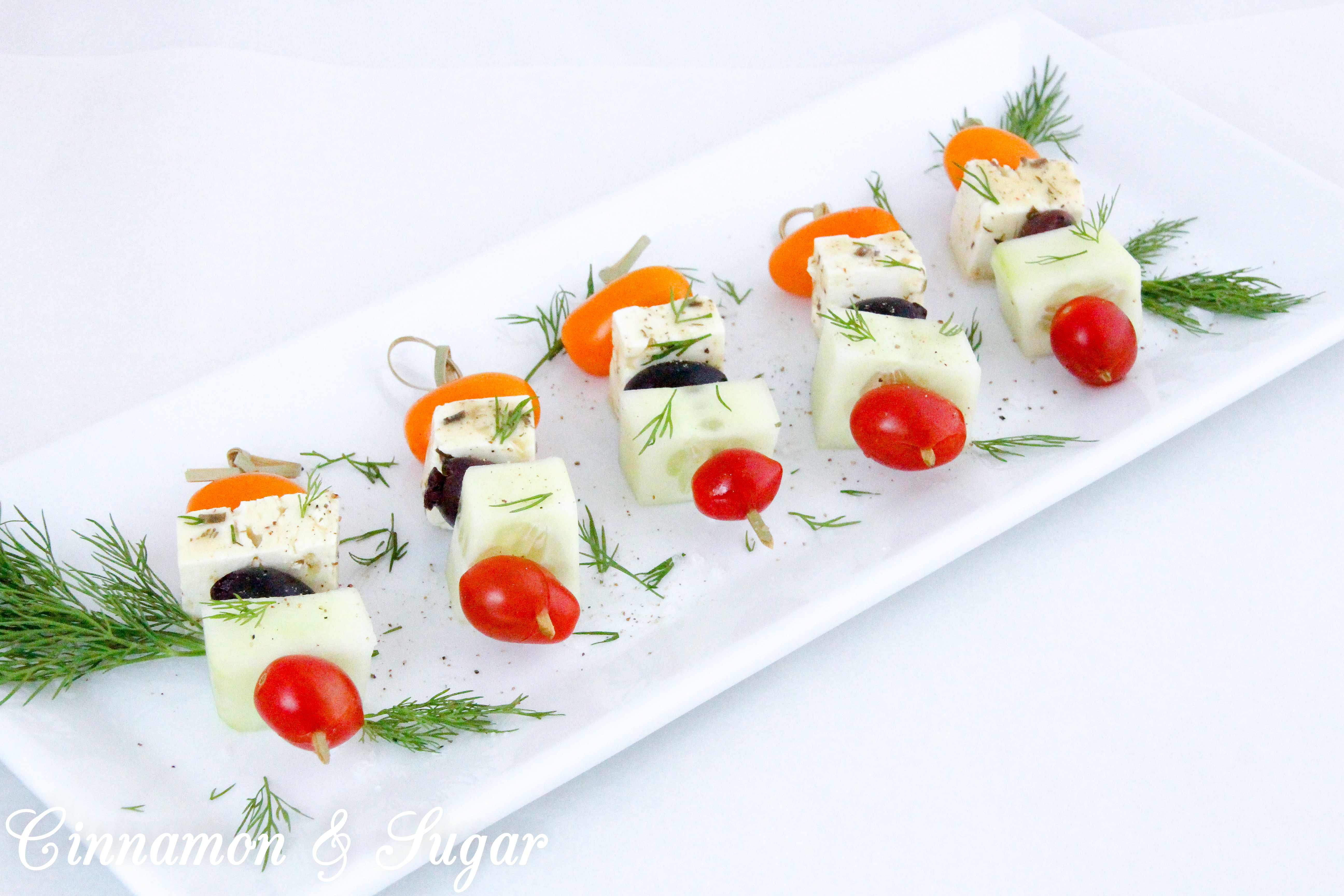 Light and refreshing, Greek Salad Skewers are mini appetizers that are quick to make and provide a fun, healthy way to satisfy pre-dinner appetites. Recipe shared with permission granted by Jenn McKinlay, author of WORD TO THE WISE.