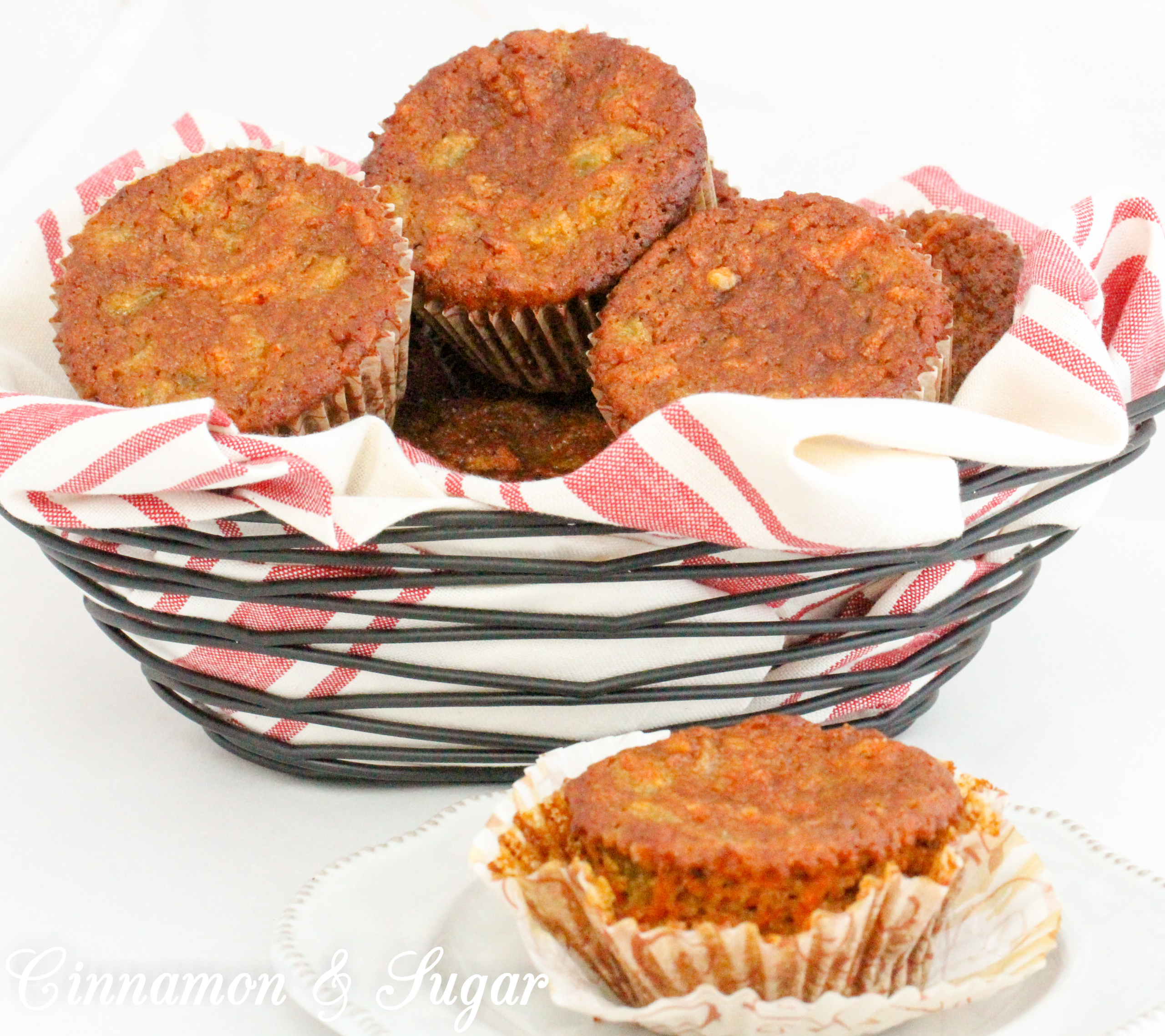 Paleo Carrot Cake Muffins with Rum Raisins are chock-full of flavor and moistness thanks to rum-infused golden raisins, a generous portion of carrots, with warming spices and honey. Recipe shared with permission granted by Libby Klein, author of THEATER NIGHTS ARE MURDER. 