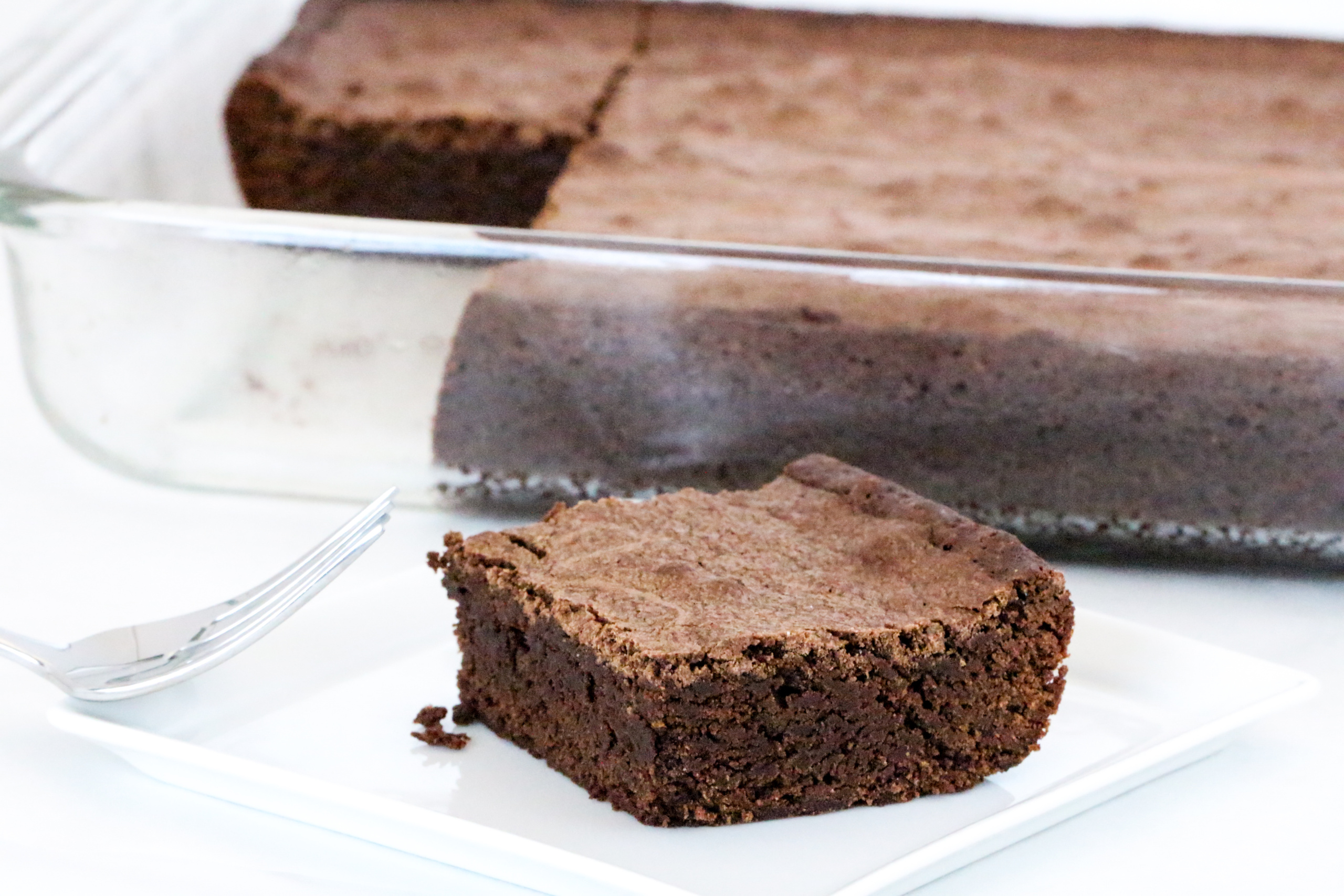 Rich and thick, almost like fudge, Olga's Brownies are scrumptious treats that will satisfy the most avid chocoholic! And cleanup is a breeze since the recipe uses only 1 saucepan to whisk the ingredients together. Recipe shared with permission granted by Barbara Ross, author of SEALED OFF. 