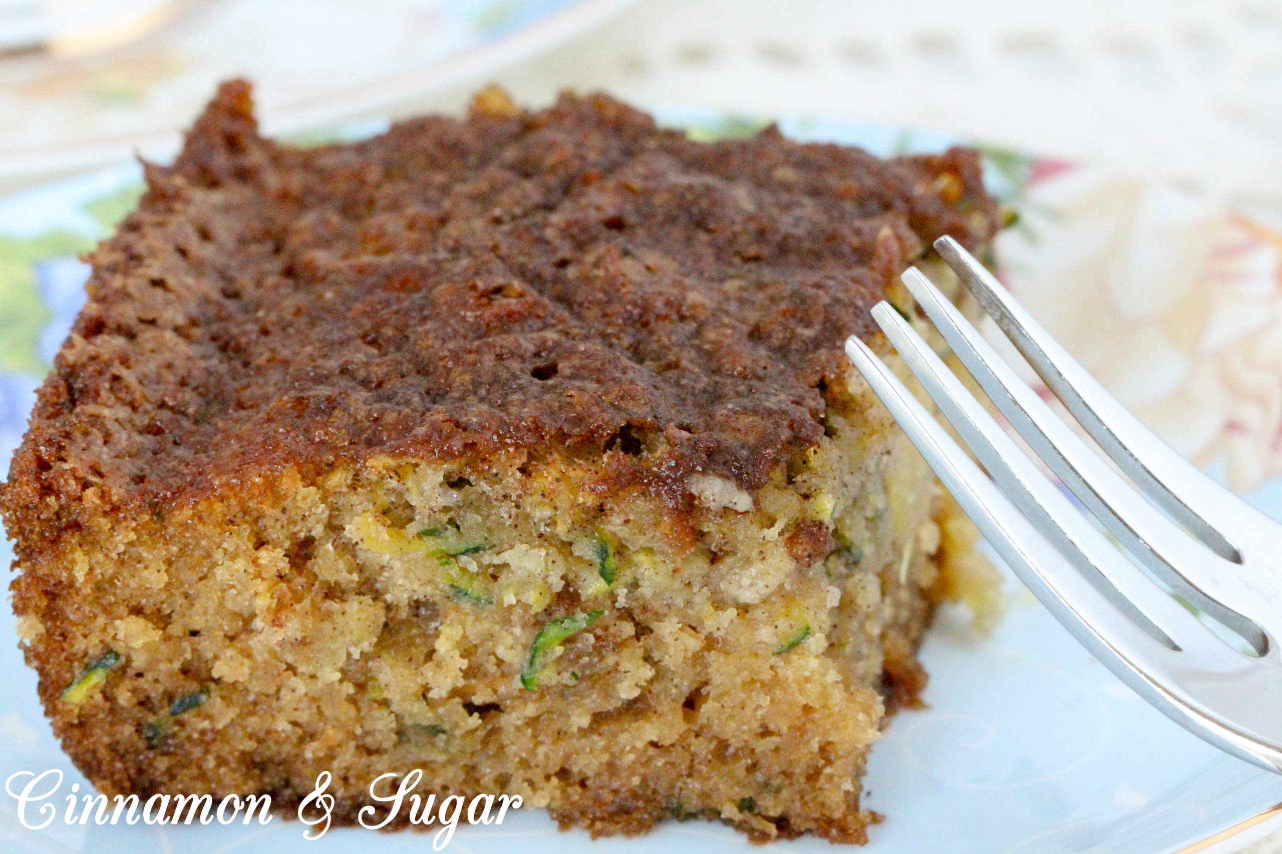 With a combination of both veggies and fruit, Zucchini Pineapple Cake is a supremely moist cake that's suitable for both dessert, snacks, or even breakfast. Recipe shared with permission granted by Krista Davis, author of THE DOG WHO KNEW TOO MUCH. 