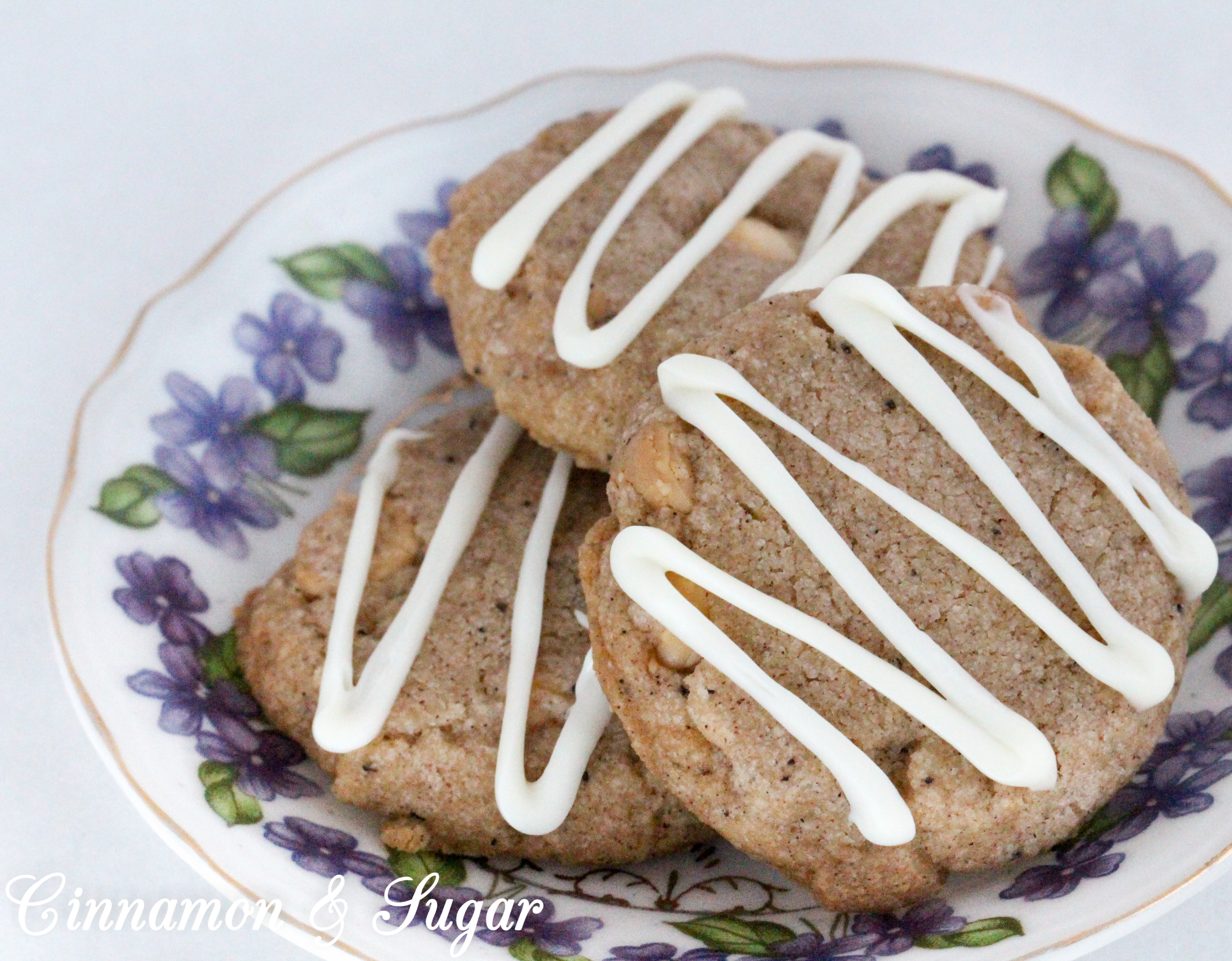 Ginger-Cardamom Tea Cookies are a shortbread-style cookies infused with English Breakfast Tea! Warming spices provide plenty of flavor while white chocolate chips give a burst of creamy sweetness to each bite. Recipe shared with permission granted by Laura Childs, author of LAVENDER BLUE MURDER. 