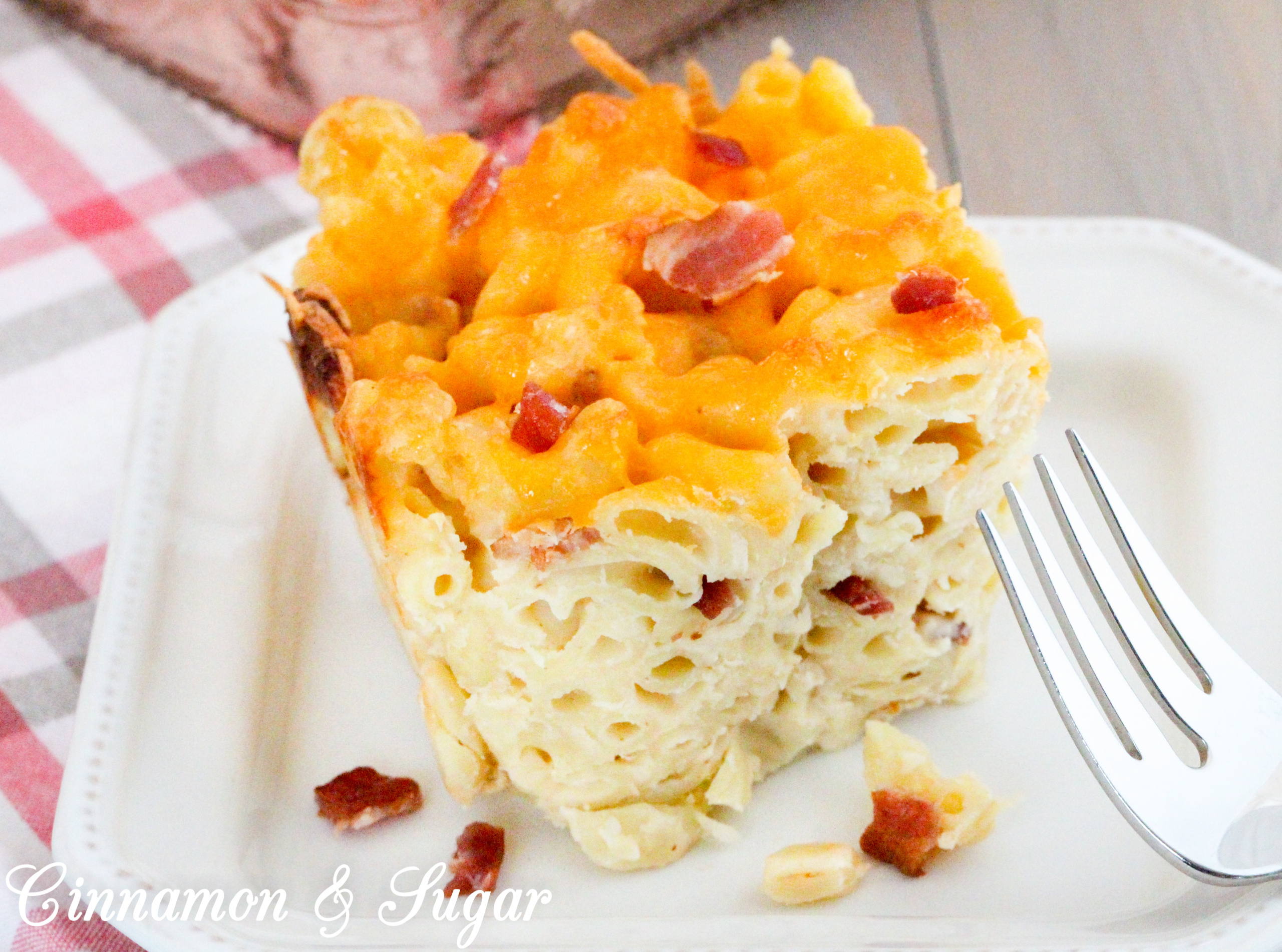 Missi's Mac and Cheese is rich, without the use of heavy cream and has plenty of flavor thanks to the addition of crisp, smoky bacon. Recipe shared with permission granted by Rosie A. Point, author of THE BURGER BAR MYSTERIES.