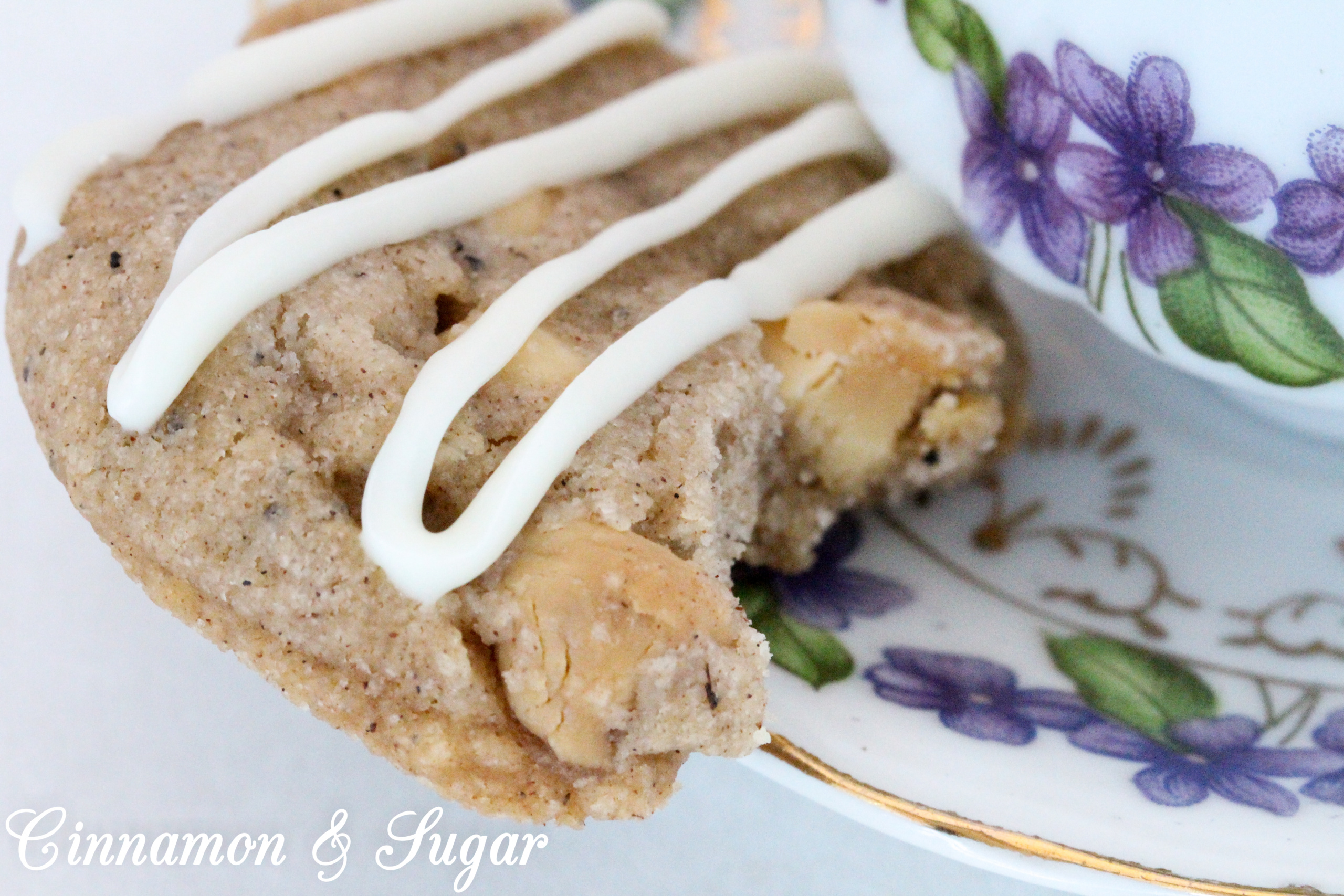 Ginger-Cardamom Tea Cookies are a shortbread-style cookies infused with English Breakfast Tea! Warming spices provide plenty of flavor while white chocolate chips give a burst of creamy sweetness to each bite. Recipe shared with permission granted by Laura Childs, author of LAVENDER BLUE MURDER. 