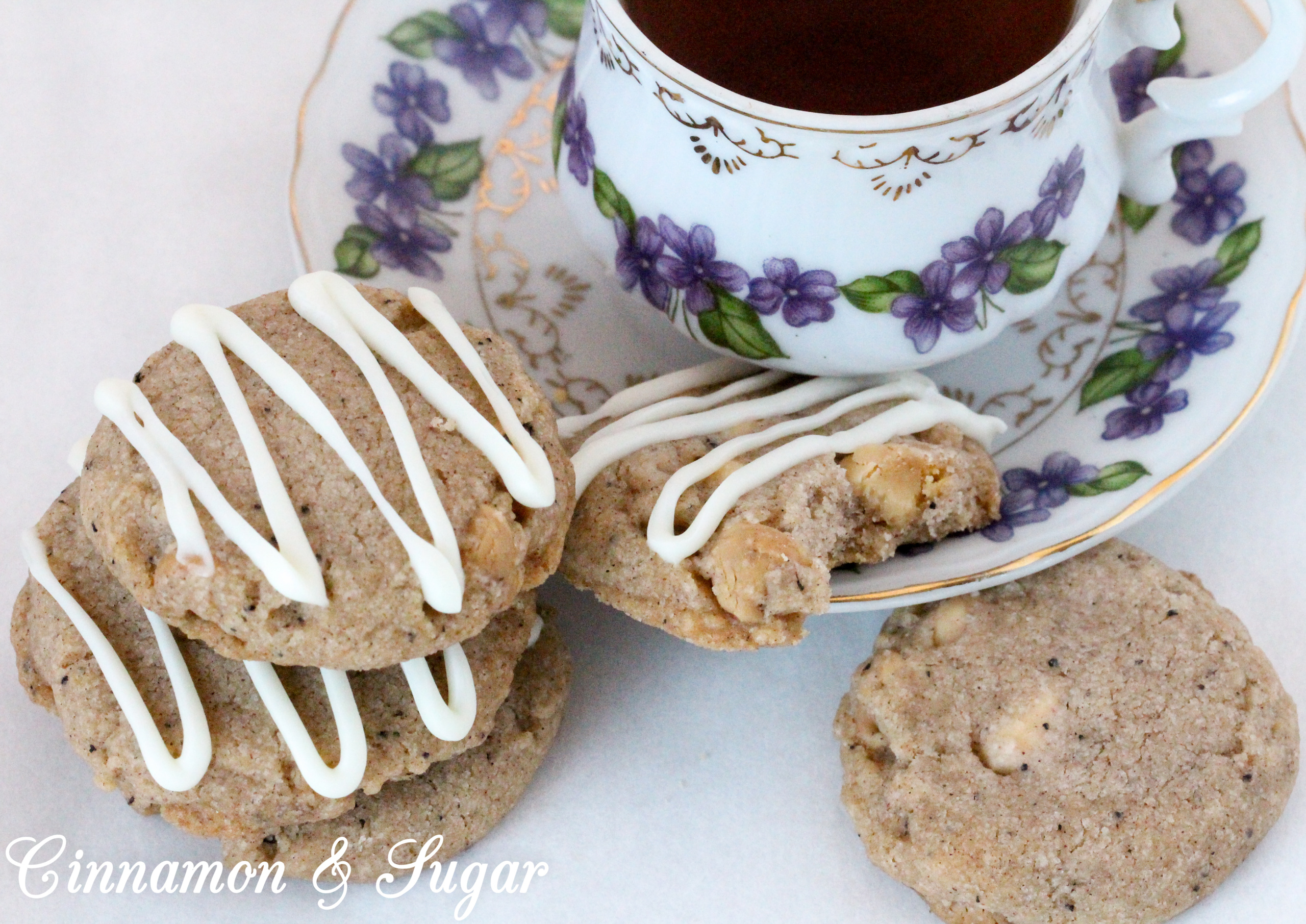 Ginger-Cardamom Tea Cookies are a shortbread-style cookies infused with English Breakfast Tea! Warming spices provide plenty of flavor while white chocolate chips give a burst of creamy sweetness to each bite. Recipe shared with permission granted by Laura Childs, author of LAVENDER BLUE MURDER. 