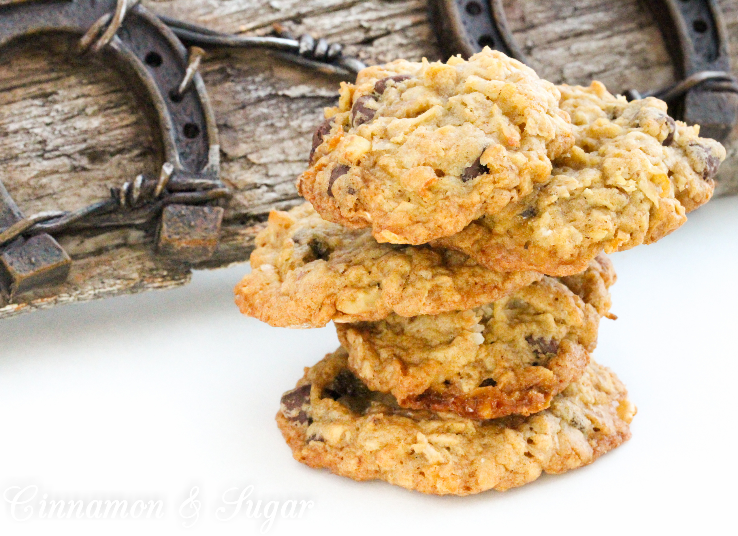 Cowgirl Cookies are the riff to Cowboy Cookies for a little girl's party. Brown sugar based cookie dough is stuffed full of oats, chocolate chips, coconut, marshmallows, and walnuts for a substantial mouthwatering cookie. Recipe from cozy mystery SPRINKLES OF SUSPICION by Kim Davis.