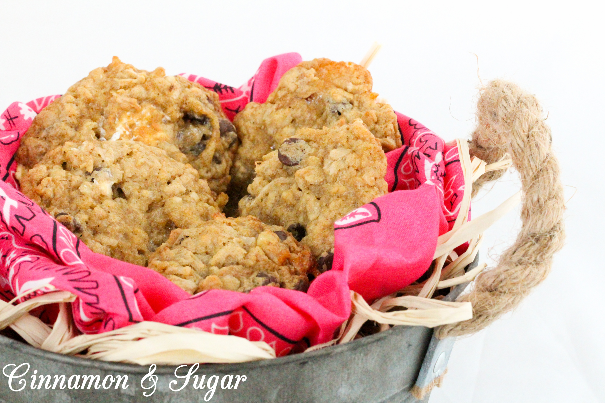 Cowgirl Cookies are the riff to Cowboy Cookies for a little girl's party. Brown sugar based cookie dough is stuffed full of oats, chocolate chips, coconut, marshmallows, and walnuts for a substantial mouthwatering cookie. Recipe from cozy mystery SPRINKLES OF SUSPICION by Kim Davis.