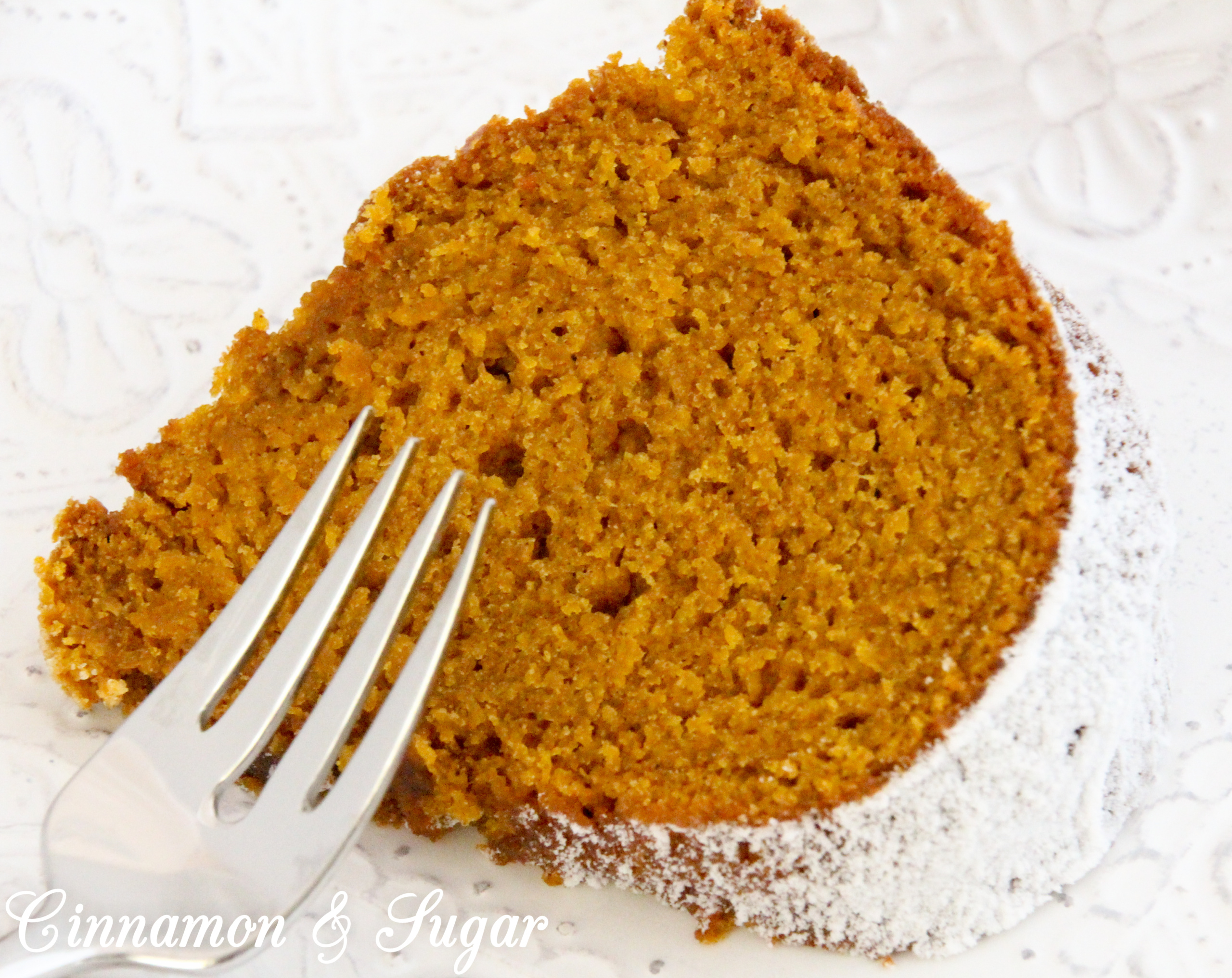 Grandma Peggy's Pumpkin Bundt Cake uses three cups of pumpkin which makes this cake super moist! The pumpkin flavor shines through and enhances the generous use of warm spices. Recipe shared with permission granted by Krista Davis, author of THE DIVA SPICES IT UP.