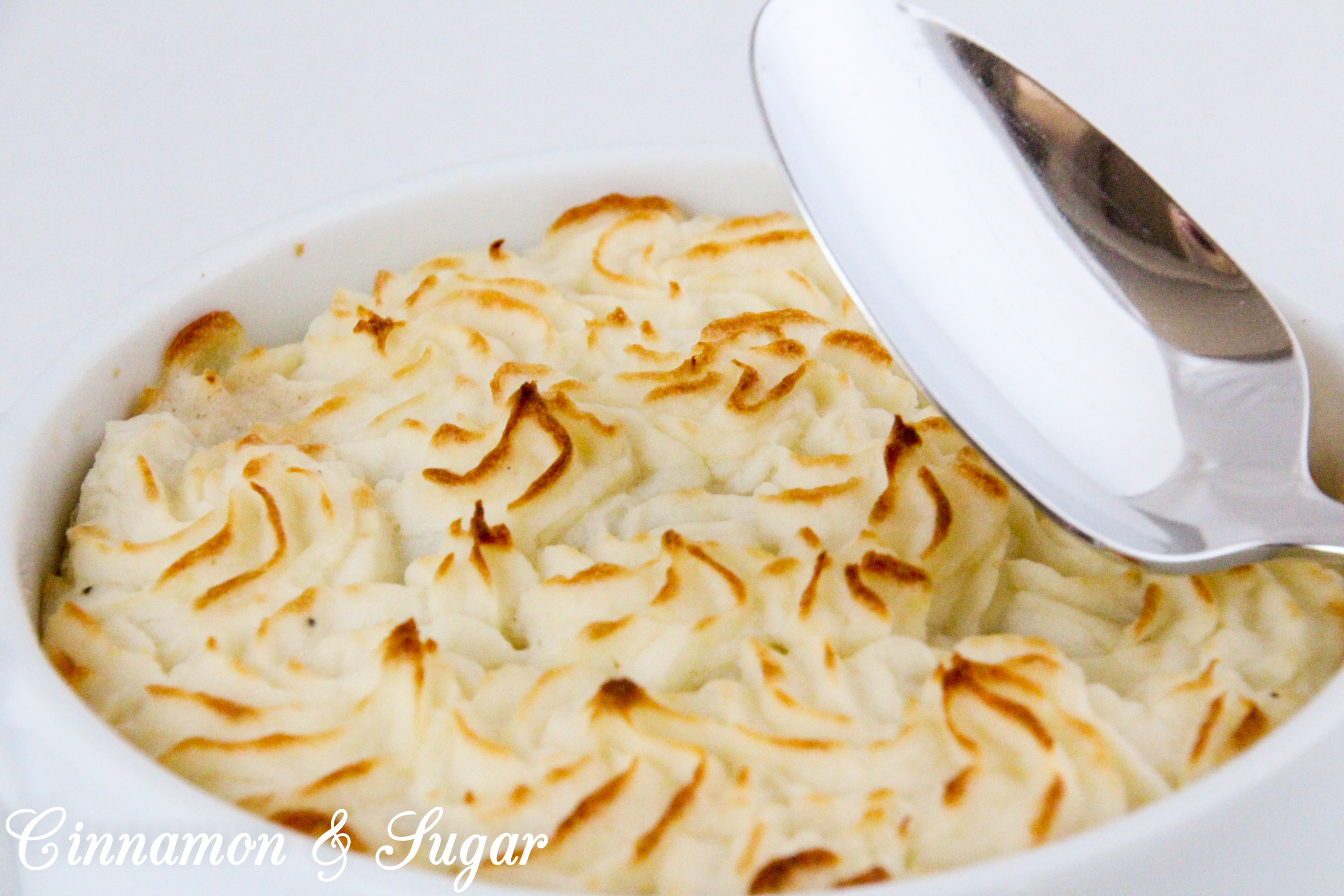 Shepherd’s Pie is comfort food at its purest! Rich browned beef and some veggies are smothered with creamy mashed potatoes and then baked to create a hearty, warming meal. Recipe shared with permission granted by Lynn Cahoon, author of DEEP FRIED REVENGE.