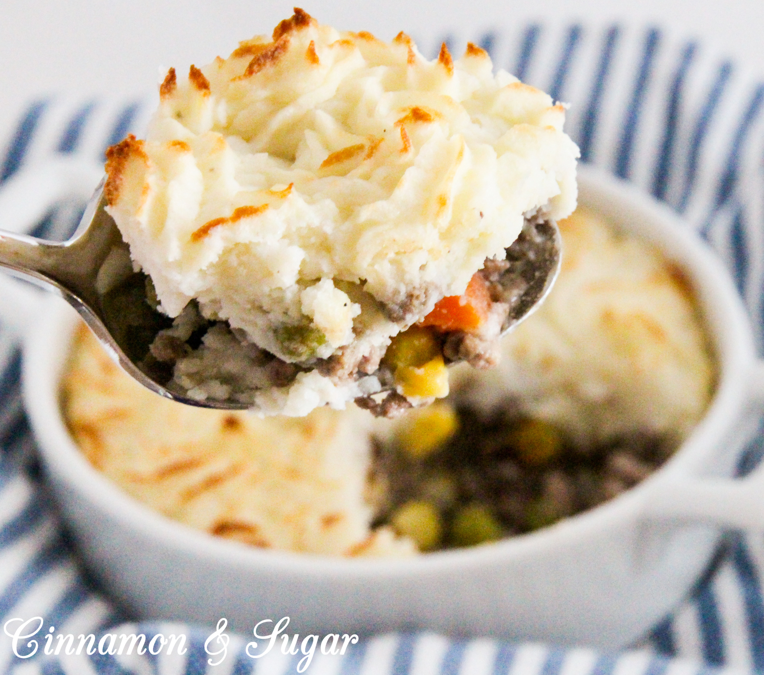 Shepherd’s Pie is comfort food at its purest! Rich browned beef and some veggies are smothered with creamy mashed potatoes and then baked to create a hearty, warming meal. Recipe shared with permission granted by Lynn Cahoon, author of DEEP FRIED REVENGE.