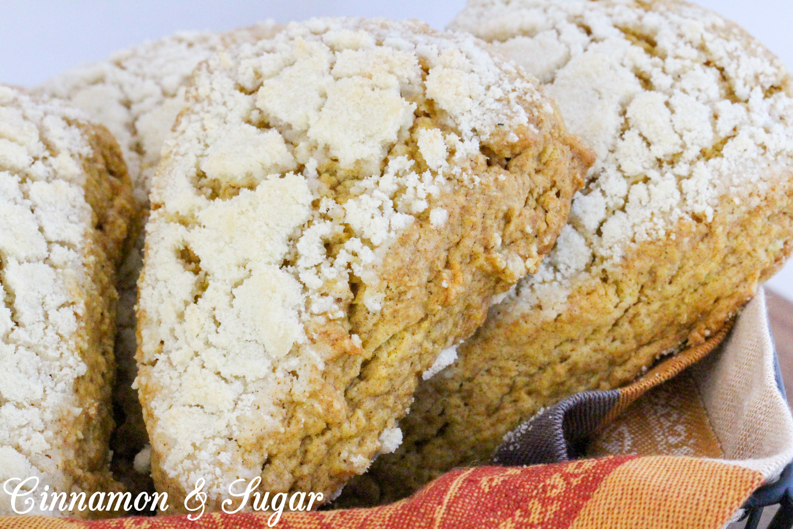 Sweet streusel complements the cinnamon in these Maple-Pumpkin Scones without being overly crumbly. Mild pumpkin brings color and a moist texture to these tea time treats. Recipe shared with permission granted by Kate Carlisle, author of THE GRIM READER. 