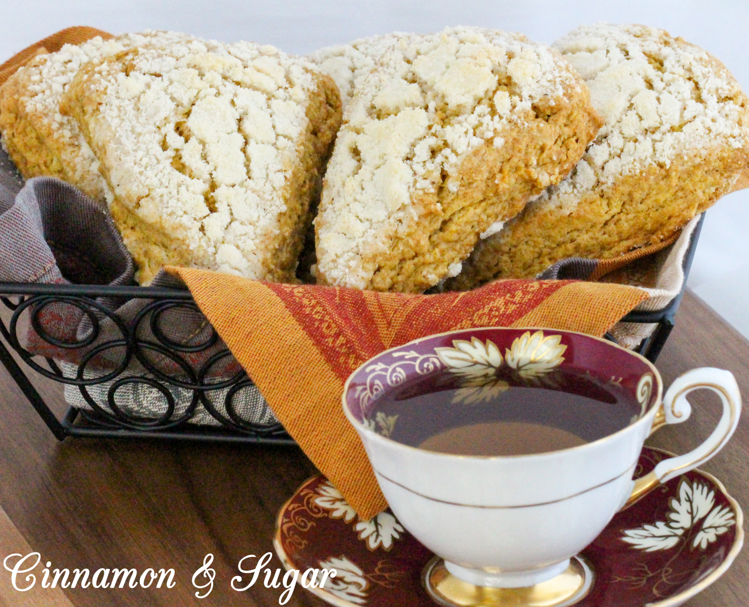 Sweet streusel complements the cinnamon in these Maple-Pumpkin Scones without being overly crumbly. Mild pumpkin brings color and a moist texture to these tea time treats. Recipe shared with permission granted by Kate Carlisle, author of THE GRIM READER. 