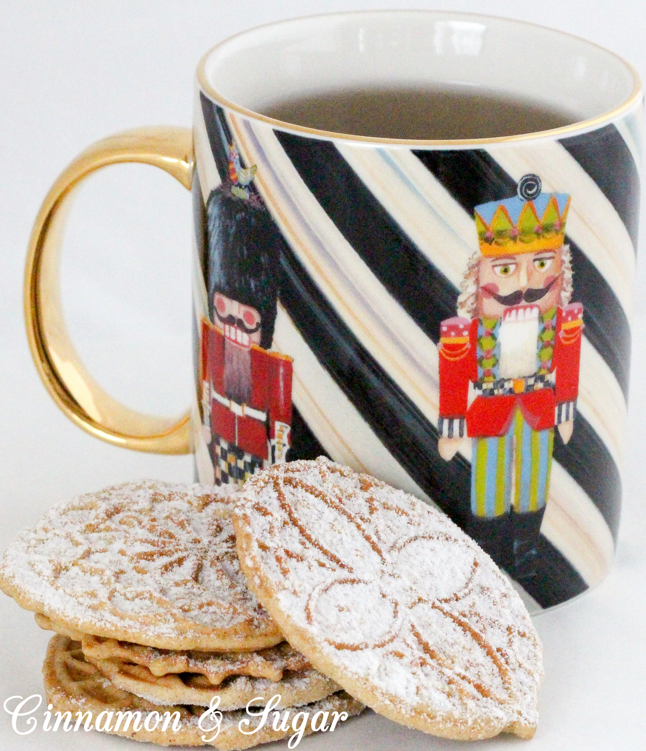 Warming spices and sugary goodness will make your kitchen smell like Christmas when you make these Gingerbread Pizzelles! Recipe created by Cinnamon & Sugar for Catherine Bruns, author of THE ENEMY YOU GNOCCHI.