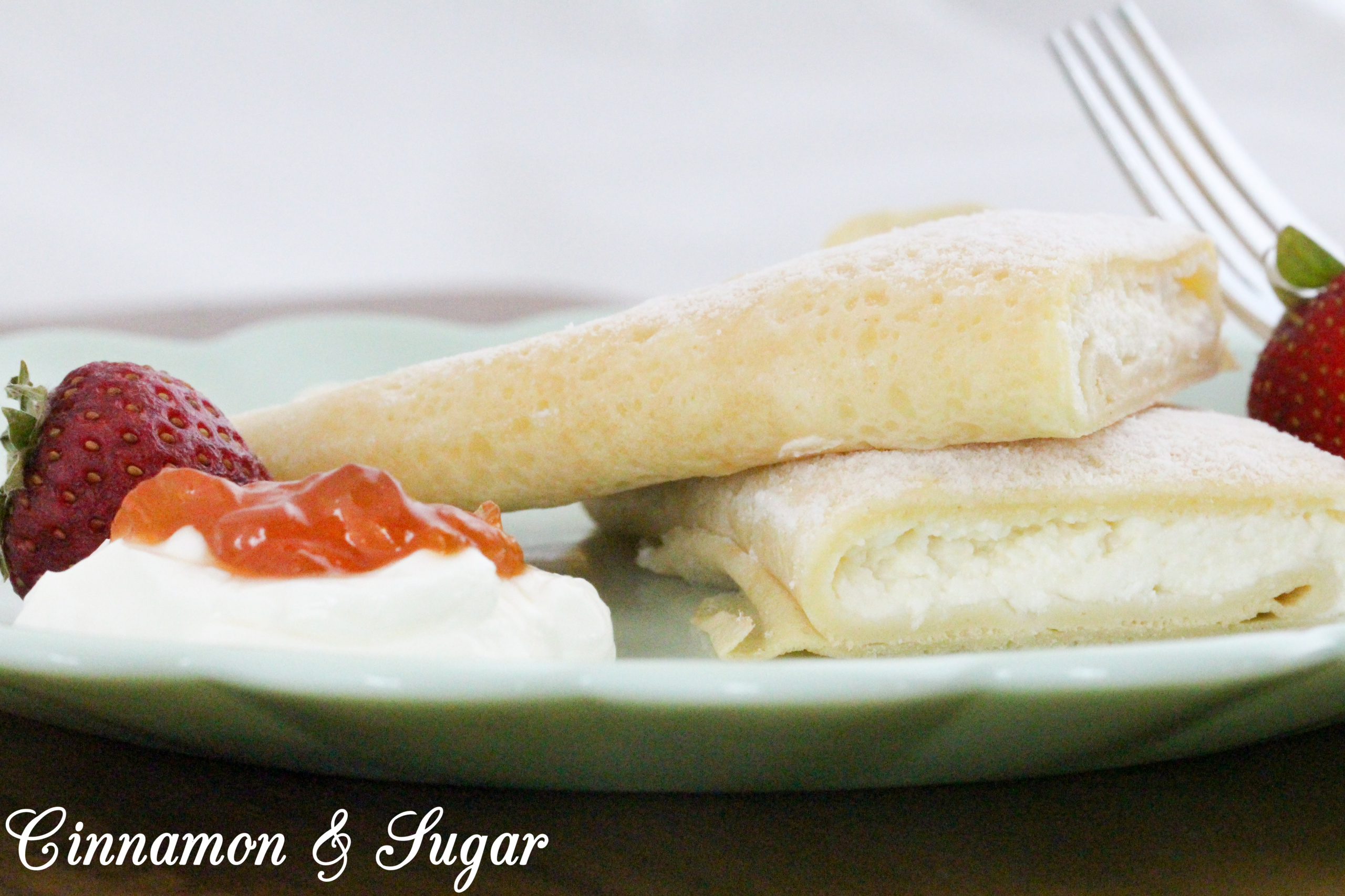 A traditional Hungarian dish, Juliana’s Palacsinta are sweet cheese-filled crepes and baked with a light sprinkle of powdered sugar after filling. Garnish with sour cream, fresh strawberries, and jam for a delicious brunch or a breakfast-themed dinner. Recipe shared with permission granted by Julia Buckley, author of DEATH OF A WANDERING WOLF. 
