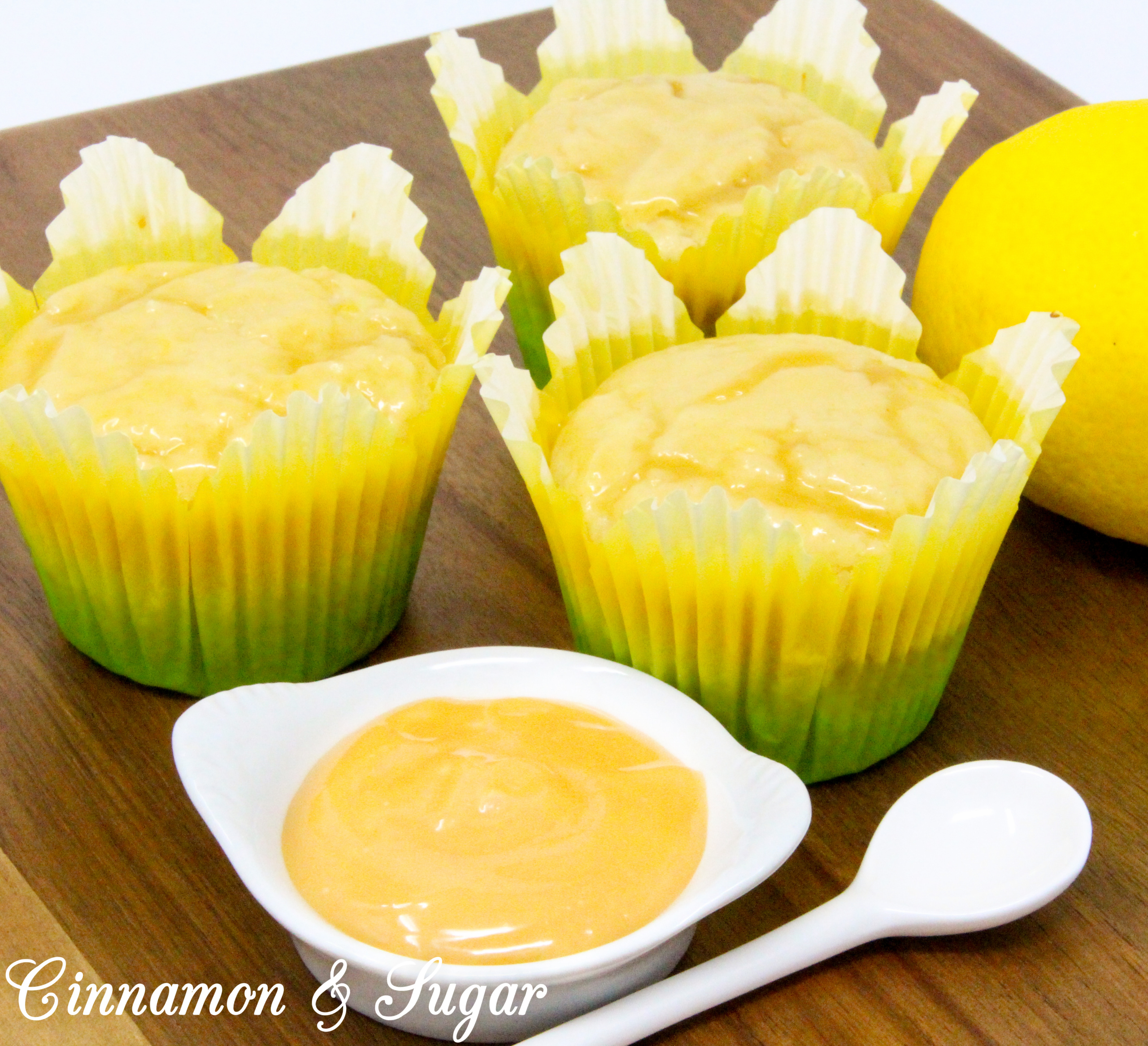 Lemon Curd Muffins are super moist and ultra flavorful thanks to the generous amounts of lemon zest, lemon juice, and lemon curd! A delicious treat for breakfast and snack time, or serve with a dollop of ice cream for dessert. Recipe shared with permission granted by Libby Klein, author of WINE TASTINGS ARE MURDER.