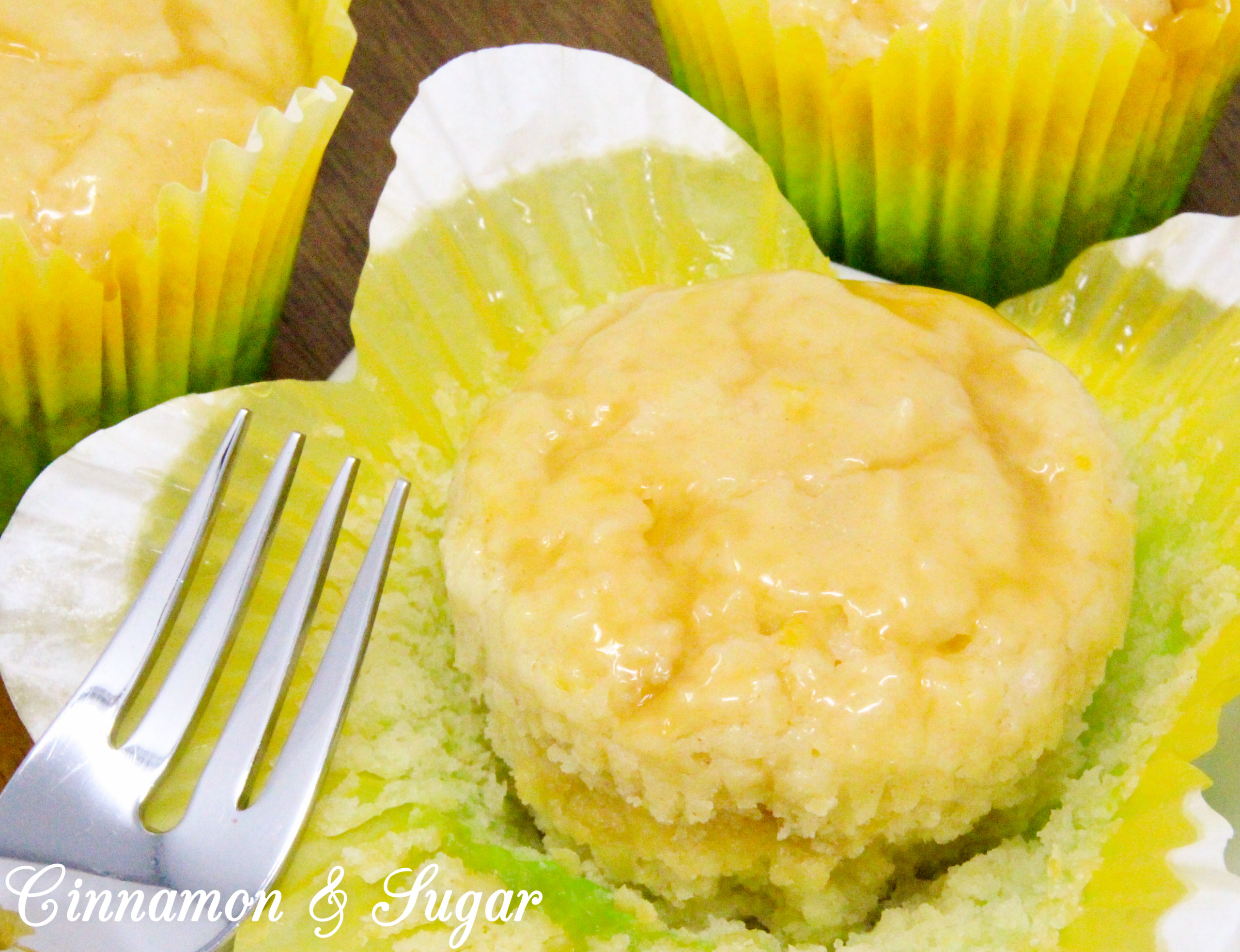 Lemon Curd Muffins are super moist and ultra flavorful thanks to the generous amounts of lemon zest, lemon juice, and lemon curd! A delicious treat for breakfast and snack time, or serve with a dollop of ice cream for dessert. Recipe shared with permission granted by Libby Klein, author of WINE TASTINGS ARE MURDER.