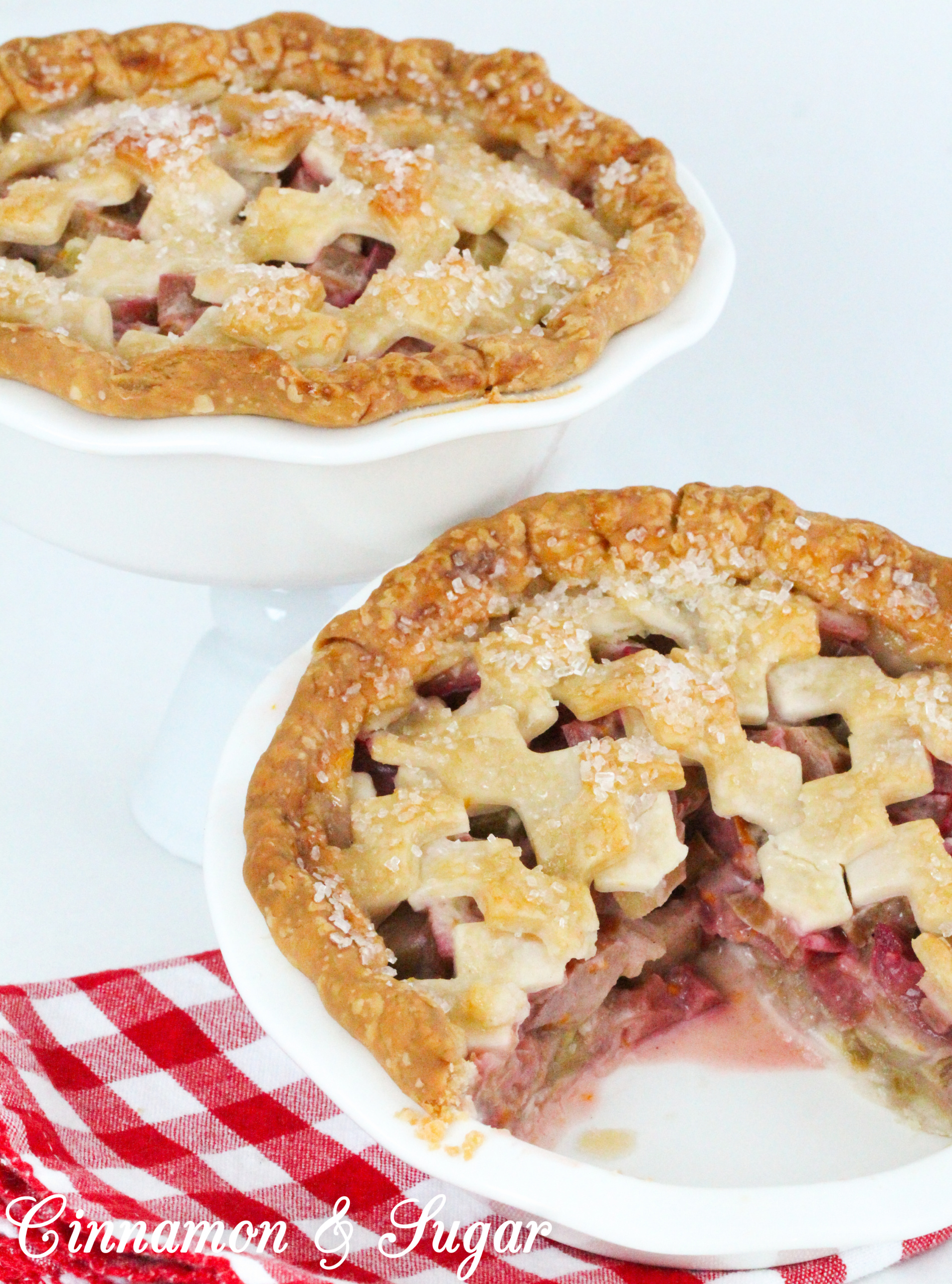 Juicy and sweet/tart, the pretty and delicious pink rhubarb filling and flaky crust make these mini rhubarb pies a delicious ending to any meal. Recipe shared with permission granted by Tracy Gardner, author of BEHIND THE FRAME.