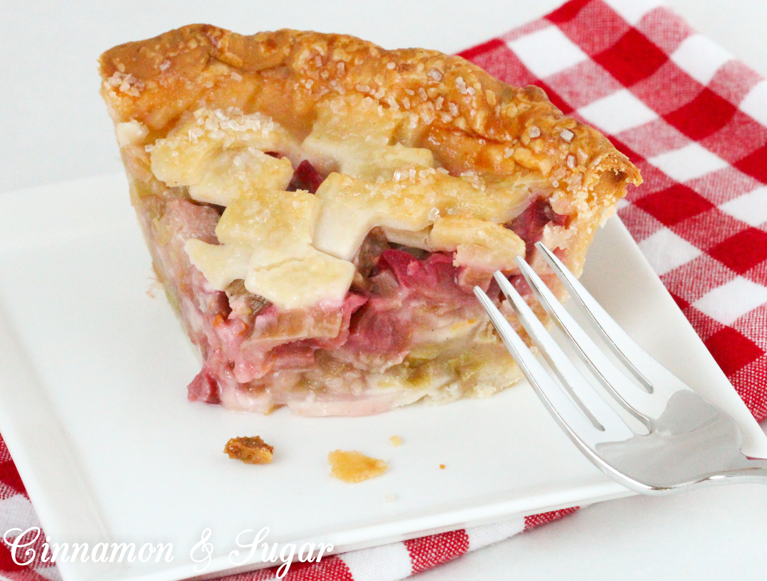 Juicy and sweet/tart, the pretty and delicious pink rhubarb filling and flaky crust make these mini rhubarb pies a delicious ending to any meal. Recipe shared with permission granted by Tracy Gardner, author of BEHIND THE FRAME.