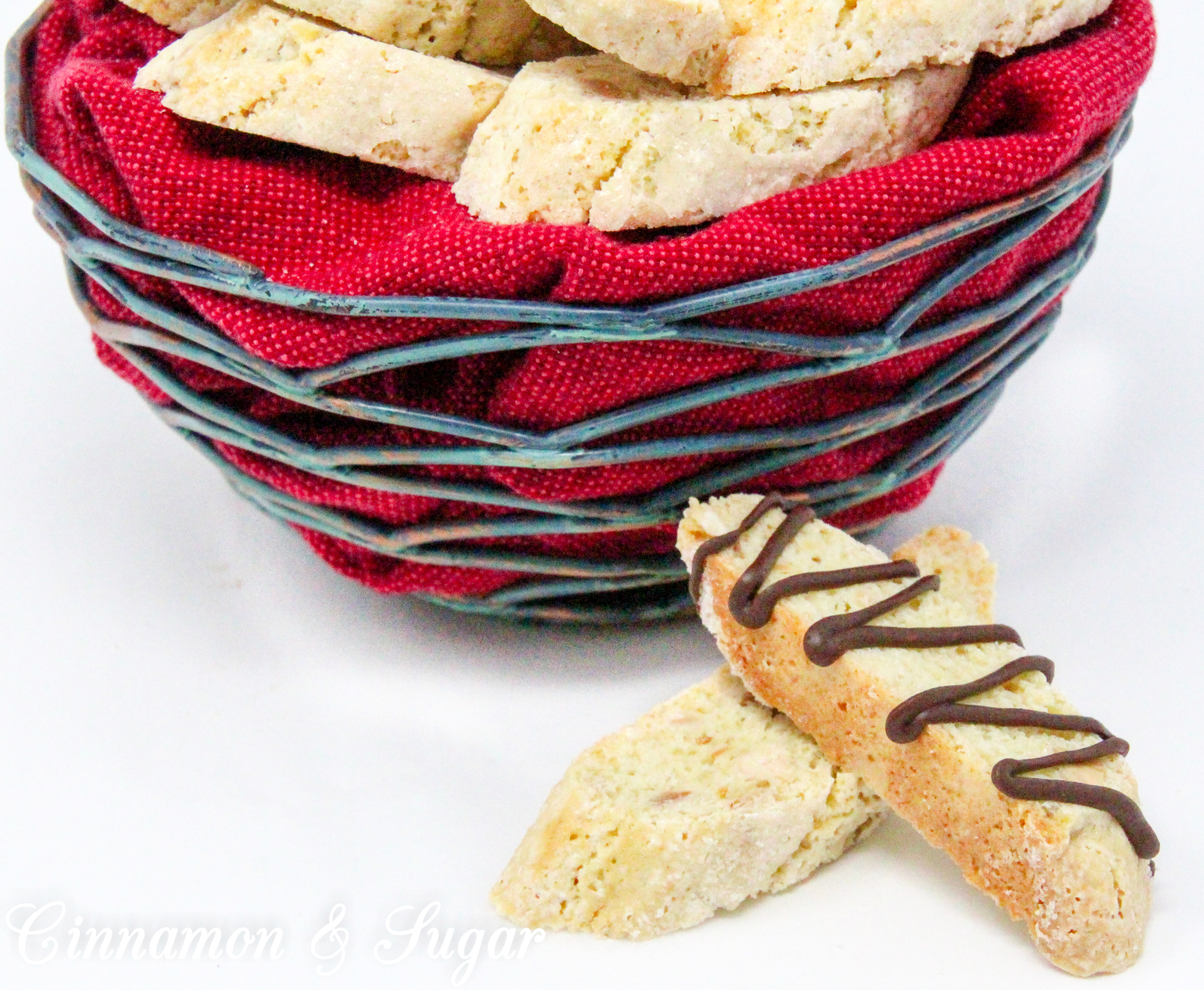 Crunchy, with a delicate almond flavor thanks to a generous amount of toasted almonds, these traditional Almond Biscotti don't contain any butter or oil. Perfect for dunking in your favorite hot beverage! Recipe shared with permission granted by Leslie Budewitz, author of THE SOLACE OF BAY LEAVES.