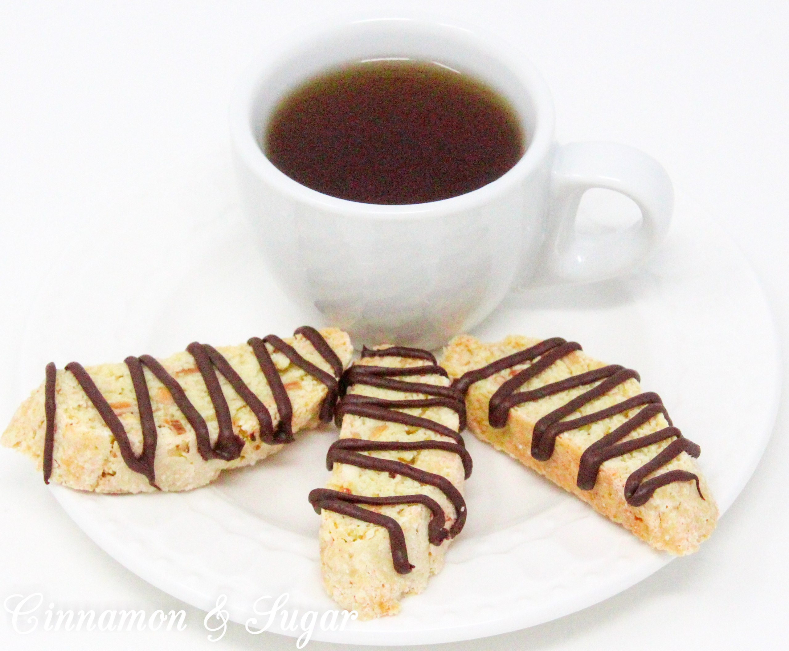 Crunchy, with a delicate almond flavor thanks to a generous amount of toasted almonds, these traditional Almond Biscotti don't contain any butter or oil. Perfect for dunking in your favorite hot beverage! Recipe shared with permission granted by Leslie Budewitz, author of THE SOLACE OF BAY LEAVES.