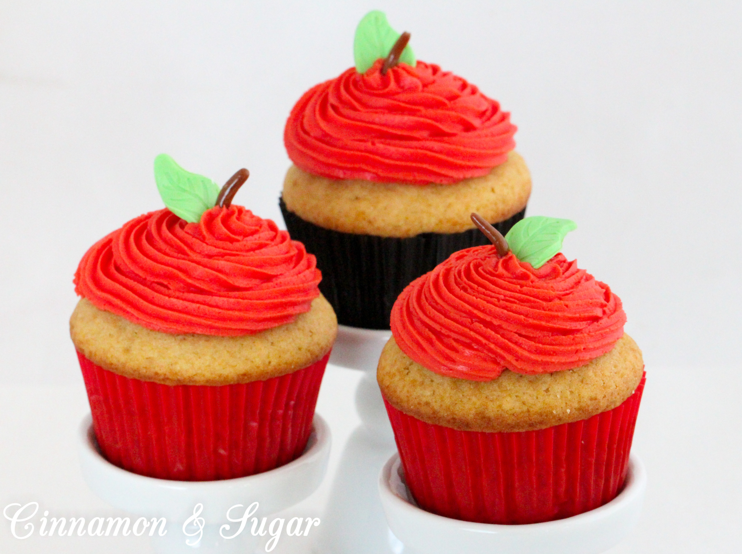 Poison Apple Cocktail Cupcakes, with generous amounts of boozy libations in both the batter and the frosting, are a fun and tasty addition to grownup Halloween celebrations. Recipe created by Kim Davis, author of CAKE POPPED OFF. 