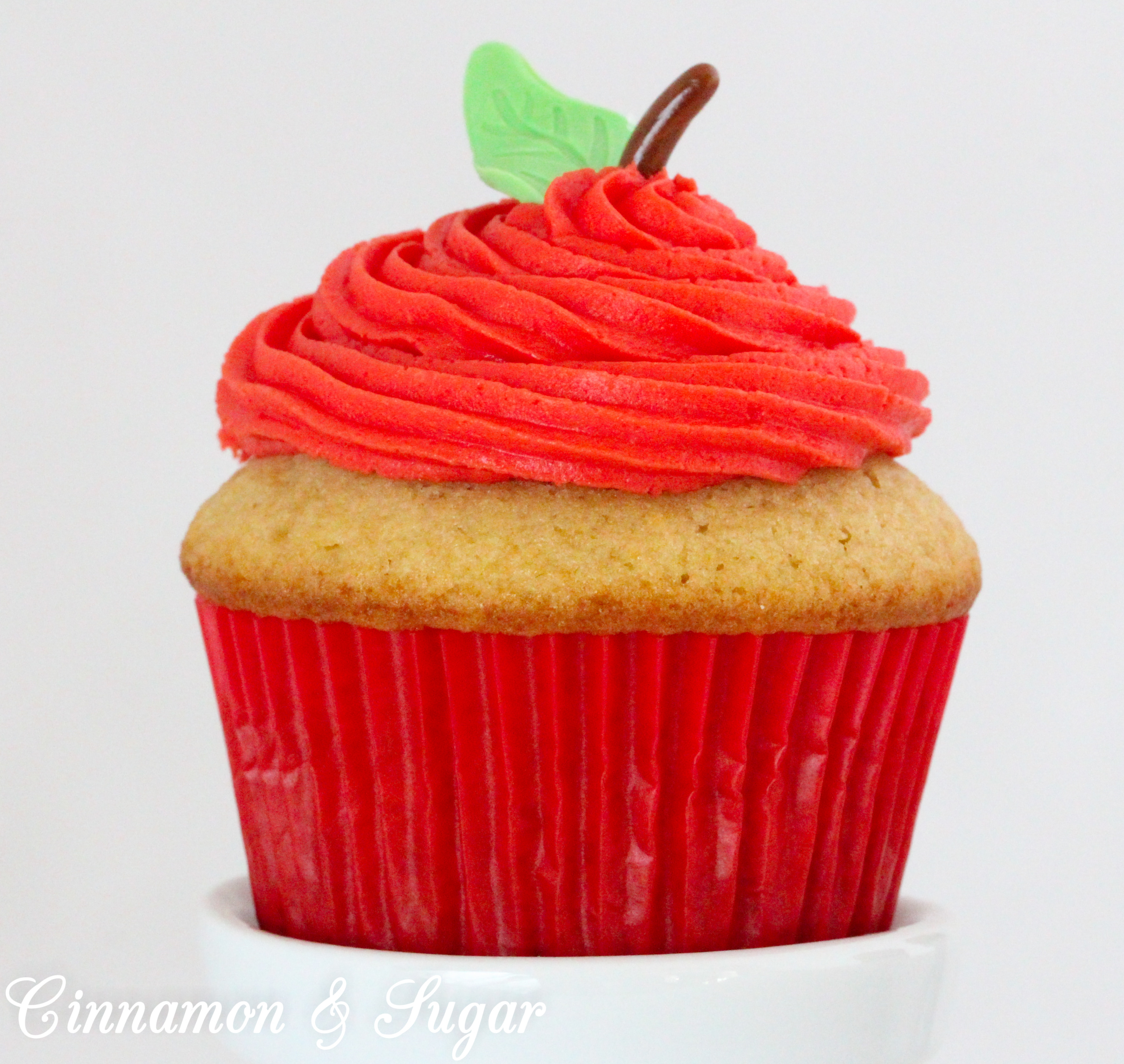 Poison Apple Cocktail Cupcakes, with generous amounts of boozy libations in both the batter and the frosting, are a fun and tasty addition to grownup Halloween celebrations. Recipe created by Kim Davis, author of CAKE POPPED OFF. 