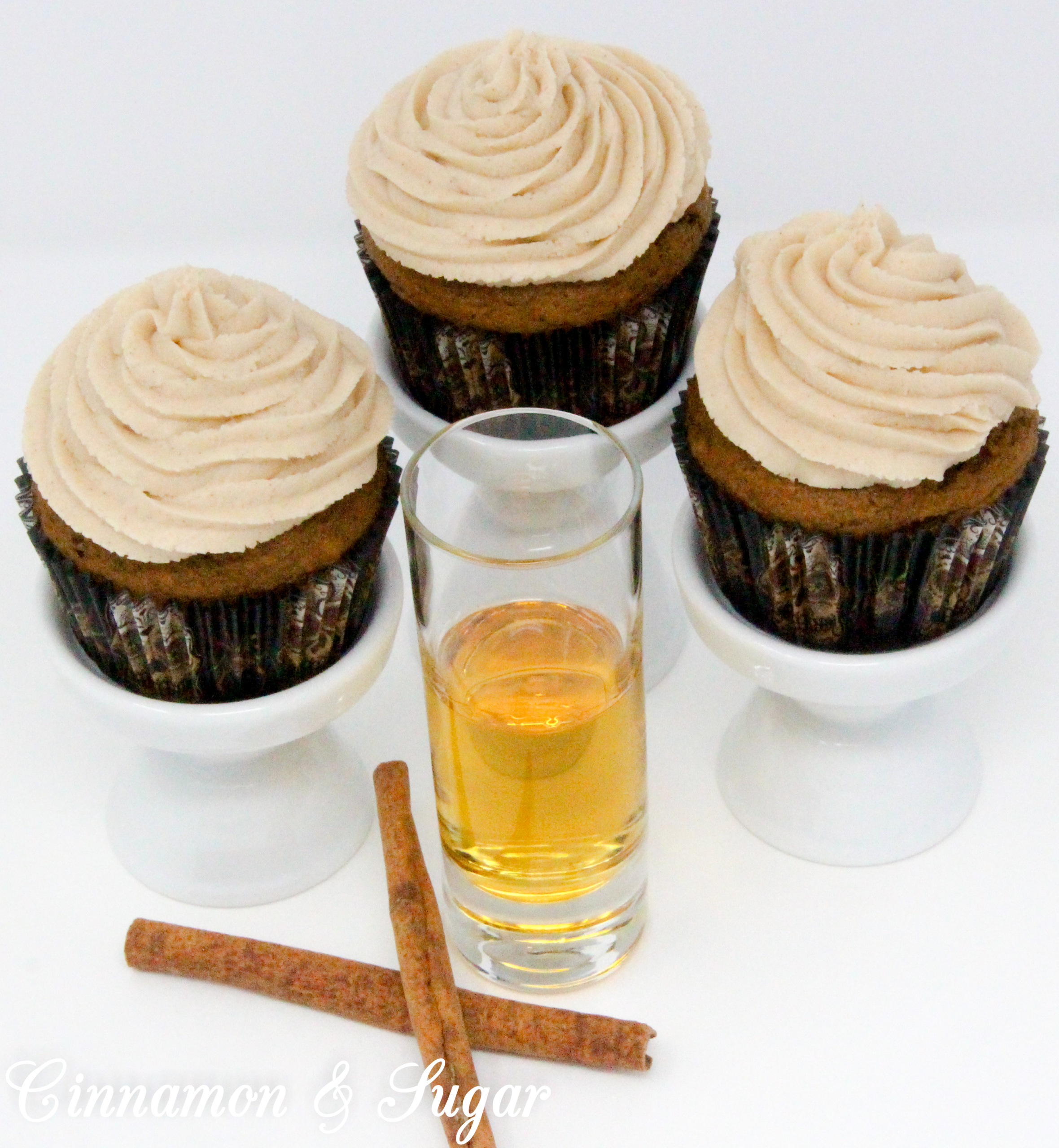 Fireball Pumpkin Spiced Coffee Cupcakes combine the flavors of fall with the bite of warming cinnamon whiskey. These cocktail cupcakes are perfect for imbibing in front of a cozy fire or sharing with friends as you celebrate autumn. Recipe created by Kim Davis, author of CAKE POPPED OFF.