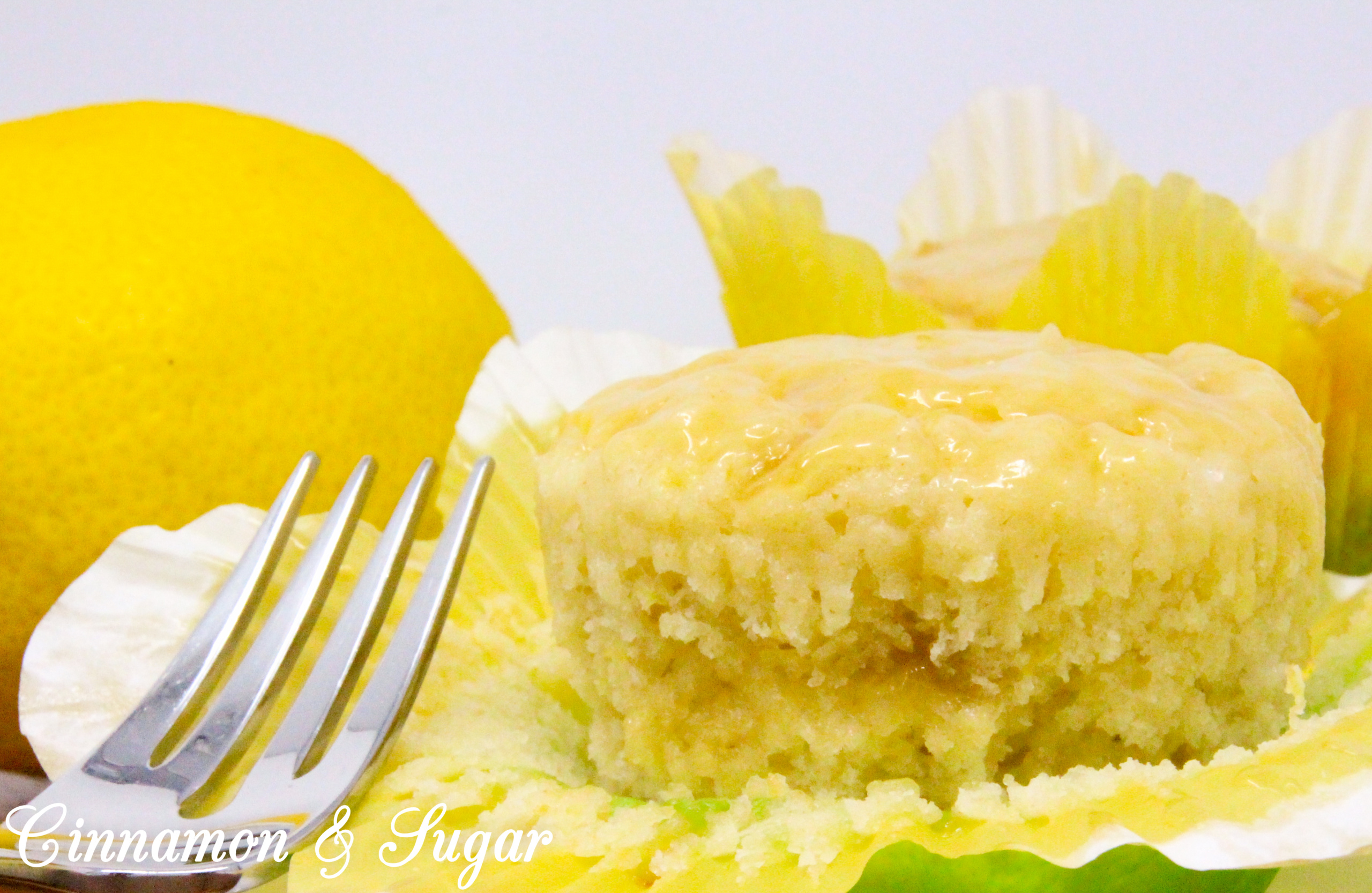 Lemon Curd Muffins are super moist and ultra flavorful thanks to the generous amounts of lemon zest, lemon juice, and lemon curd! A delicious treat for breakfast and snack time, or serve with a dollop of ice cream for dessert. Recipe shared with permission granted by Libby Klein, author of WINE TASTINGS ARE MURDER.