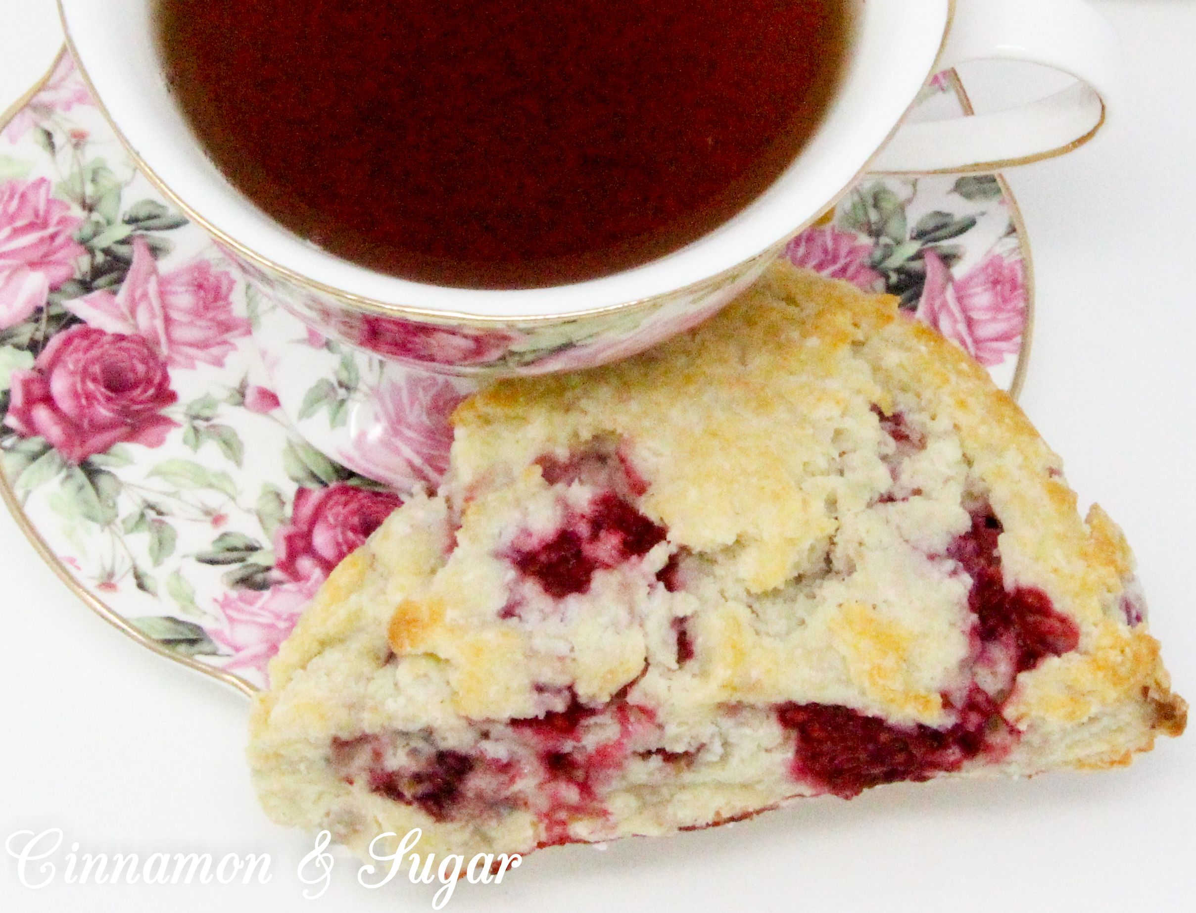 Raspberry Scones with Dark Chocolate Drizzle are rich, flaky, and flavorful, thanks to the addition of lemon oil and lemon peel, plus loads of raspberries. Drizzled with dark chocolate, the results are a scrumptious combination! 