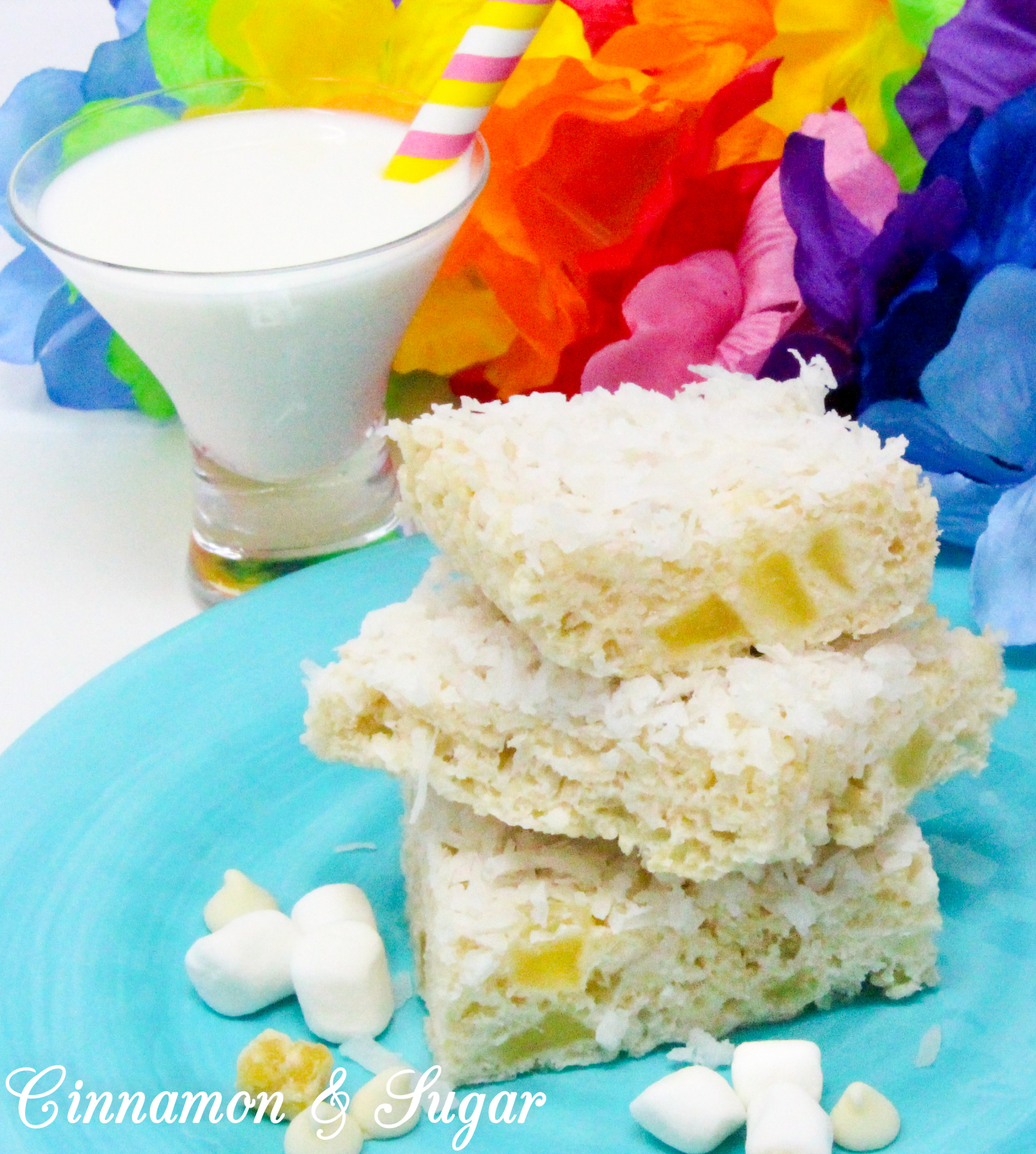 Tropical Krispie Treats are sweet and crunchy, with a hint of pineapple and rich coconut that will have you dreaming of a warm, beach-y getaway. Recipe shared with permission granted by Tara Lush, author of GROUNDS FOR MURDER.