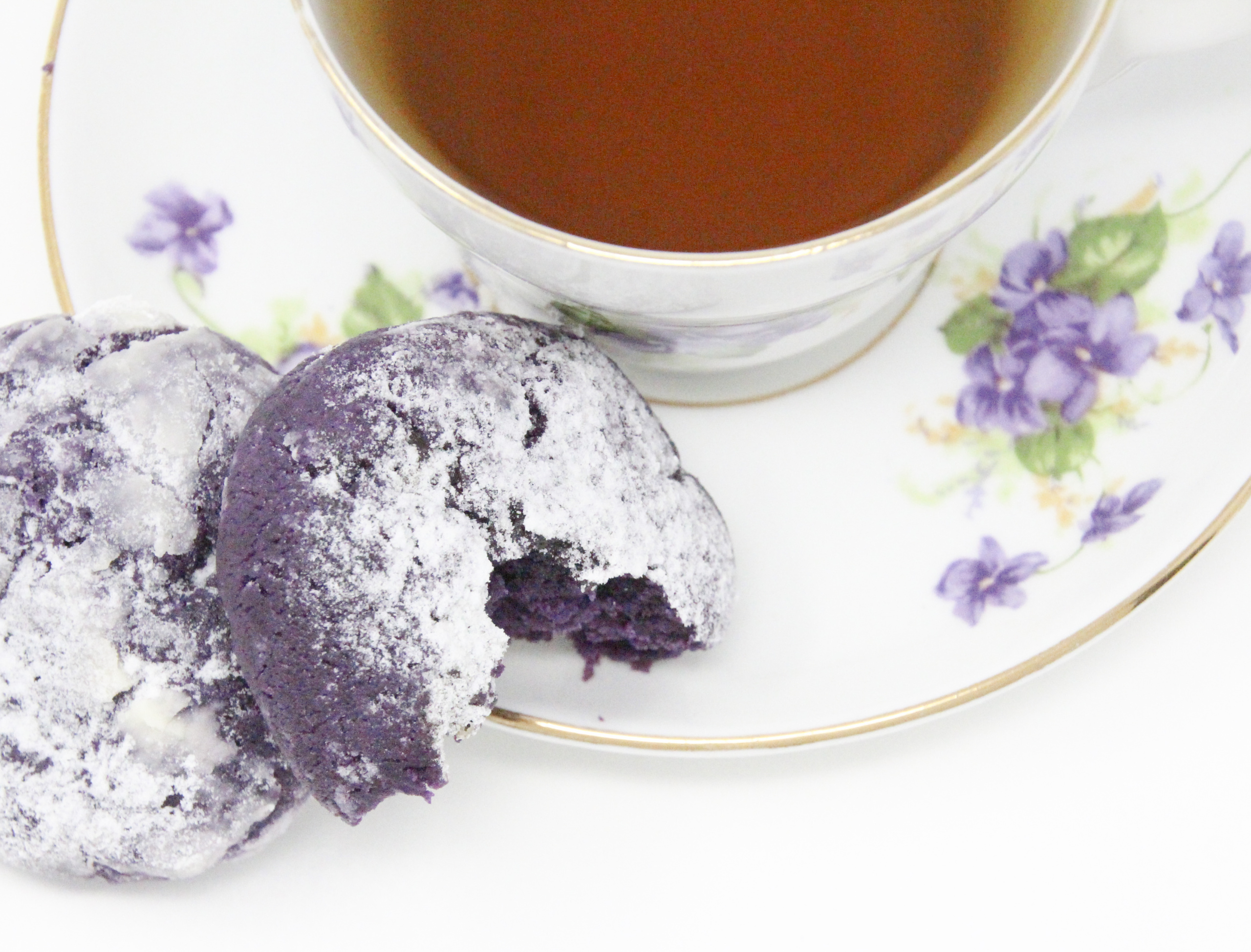 Traditional Filipino Ube Crinkles are delicious as they are unique and provide a welcome splash of color on any springtime cookie platter! Recipe shared with permission granted by Berkley Publishing, from cozy mystery ARSENIC AND ADOBO by Mia P. Manansala.