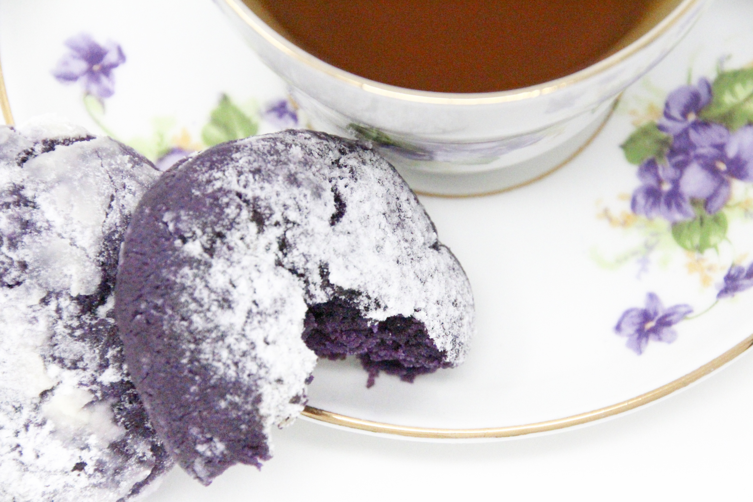 Traditional Filipino Ube Crinkles are delicious as they are unique and provide a welcome splash of color on any springtime cookie platter! Recipe shared with permission granted by Berkley Publishing, from cozy mystery ARSENIC AND ADOBO by Mia P. Manansala.