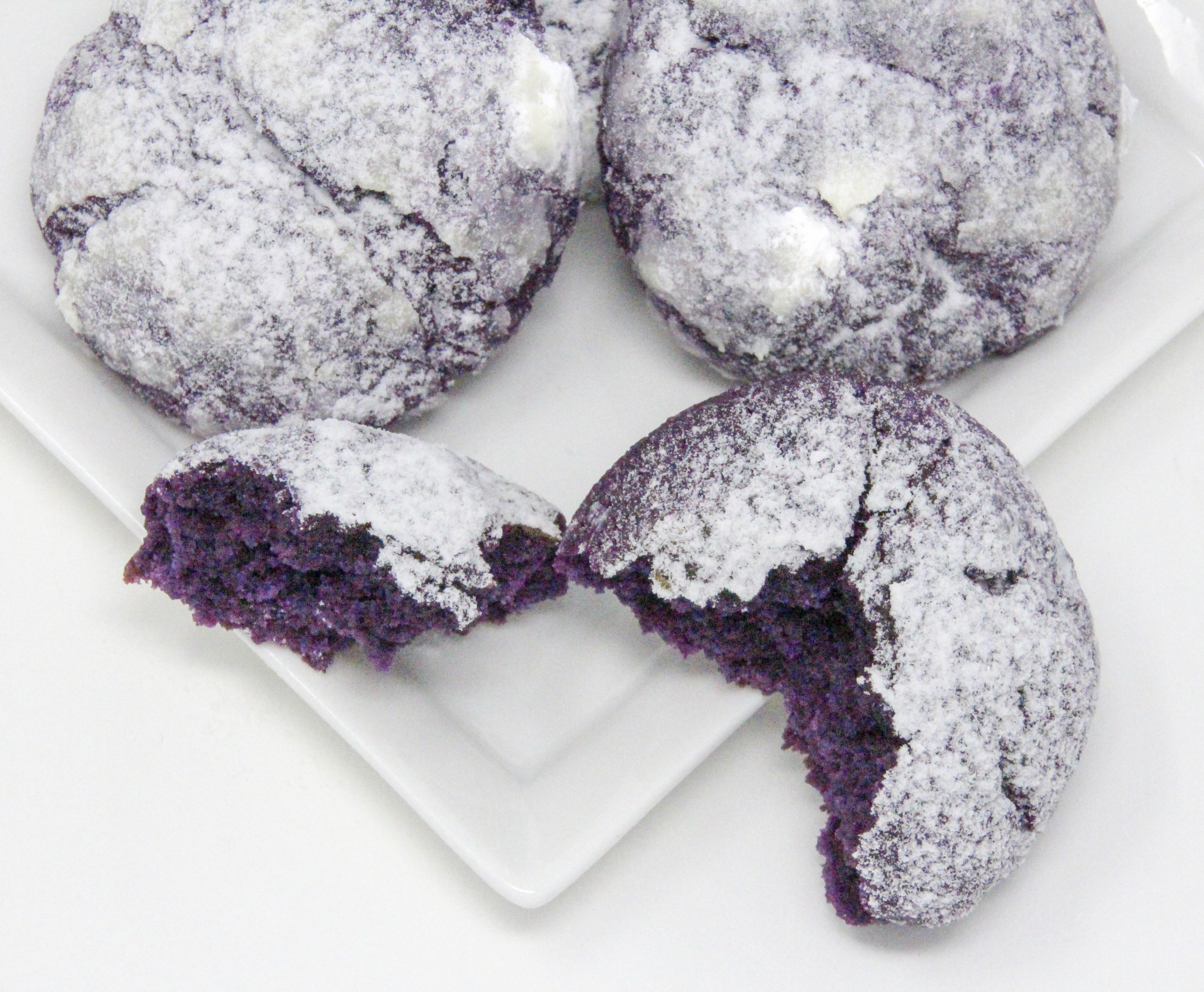 Traditional Filipino Ube Crinkles are delicious as they are unique and provide a welcome splash of color on any springtime cookie platter! Recipe shared with permission granted by Berkley Publishing, from cozy mystery ARSENIC AND ADOBO by Mia P. Manansala.