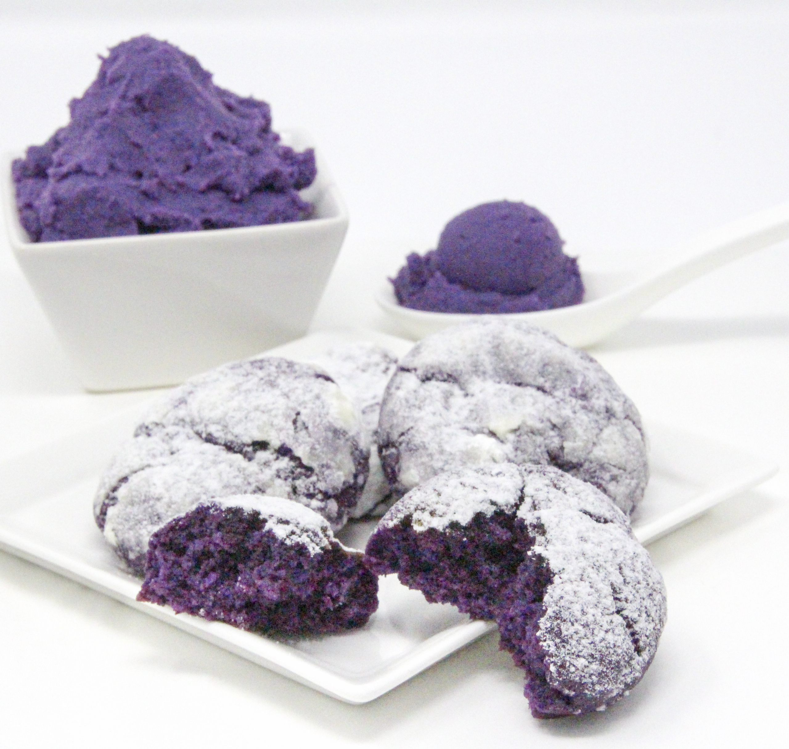 Traditional Filipino Ube Crinkles are delicious as they are unique and provide a welcome splash of color on any springtime cookie platter! Recipe shared with permission granted by Berkley Publishing, from cozy mystery ARSENIC AND ADOBO by Mia P. Manansala.