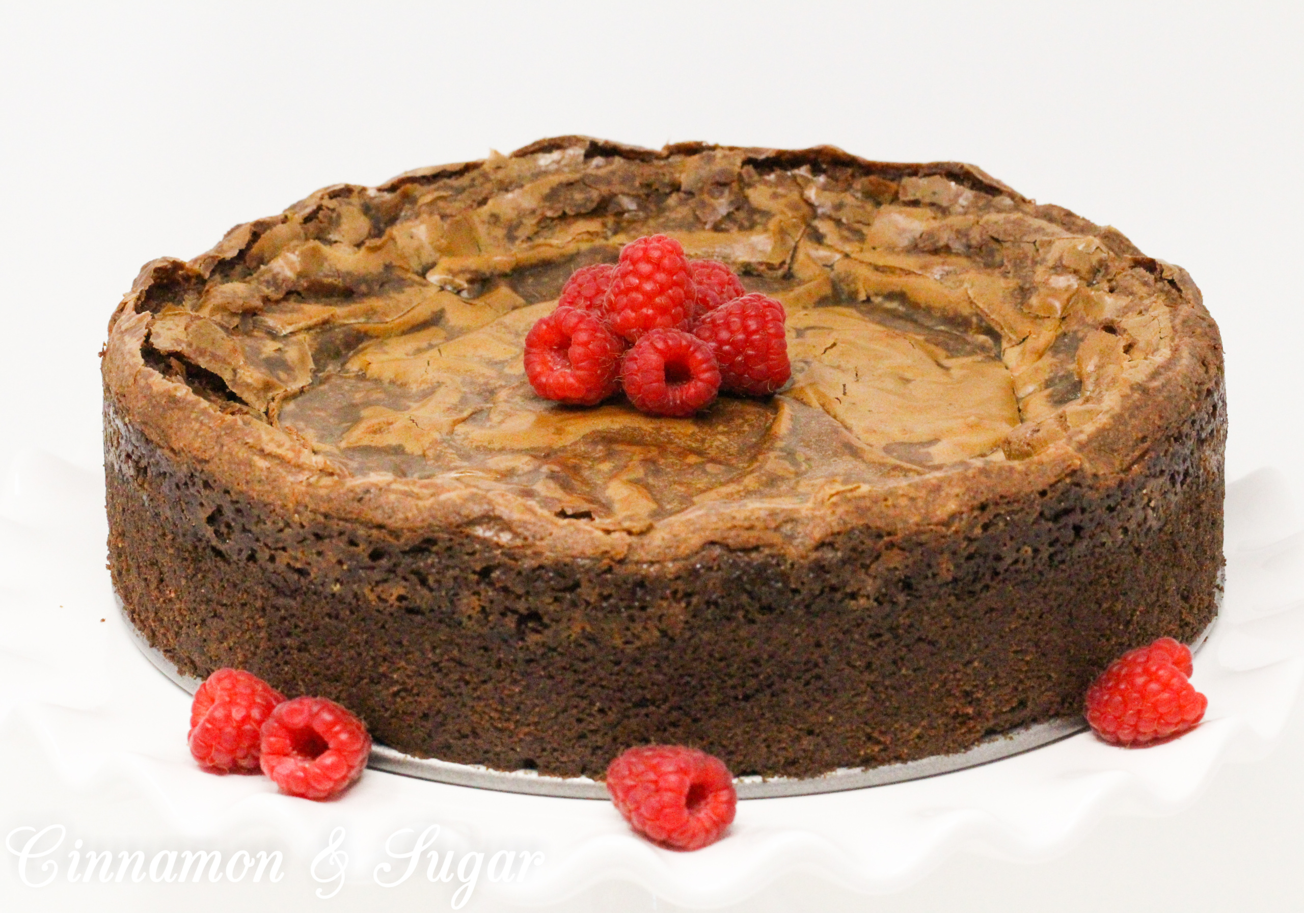 Chocolate Gooey Butter Cake is a St. Louis dessert tradition from the 1930’s. The modern version incorporates boxed cake mix to simplify matters and with the addition of dairy and pantry staples, a scrumptious dessert is created. Recipe shared with permission granted by Lynn Cahoon, author of PICTURE PERFECT FRAME.