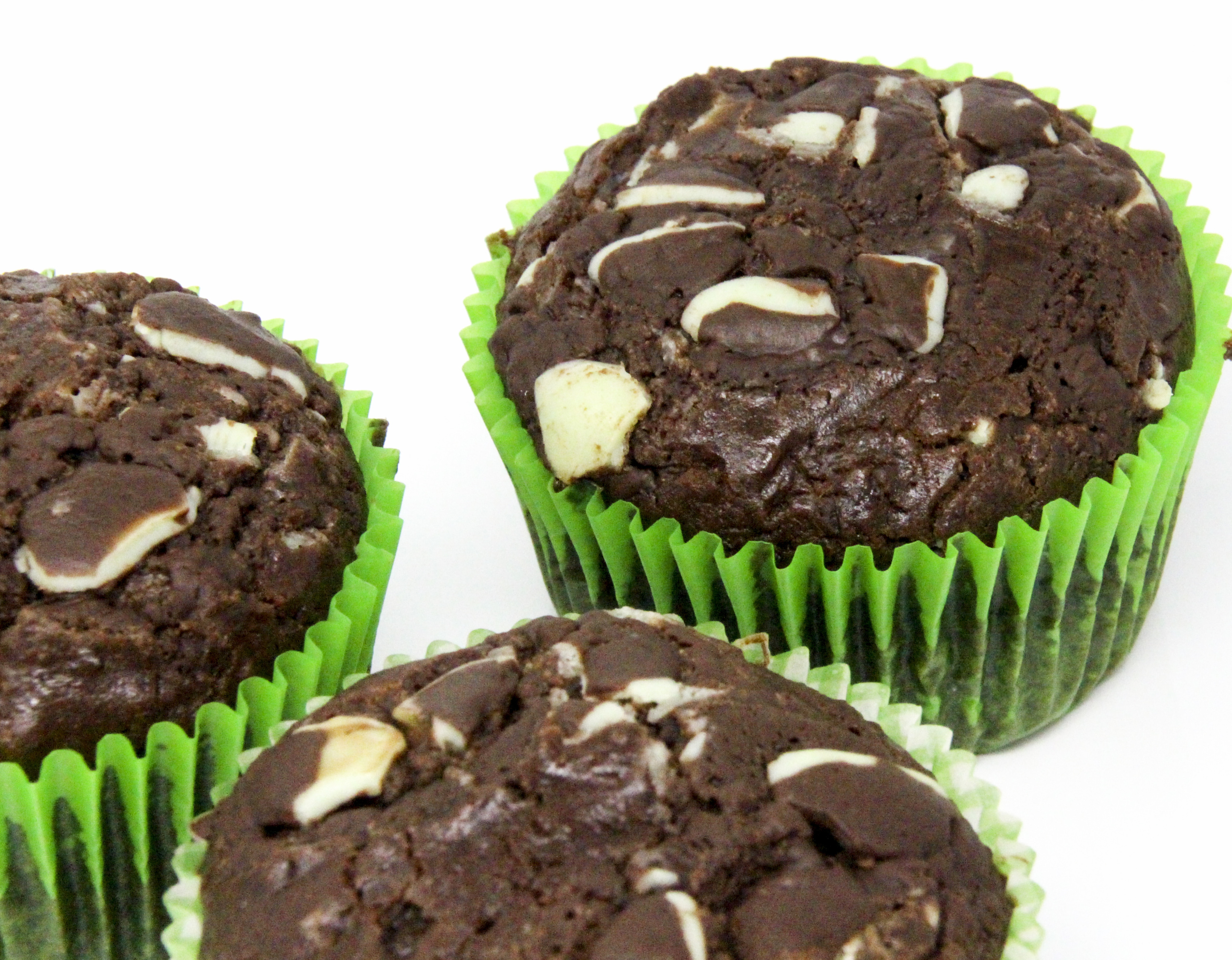 With a generous portion of of both cocoa powder and Andes Chocolate Mints, these rich Chocolate Mint Muffins could very well be classified as dessert cupcakes since they're so scrumptious! Recipe shared with permission granted by Daryl Wood Gerber, author of WINING AND DYING.