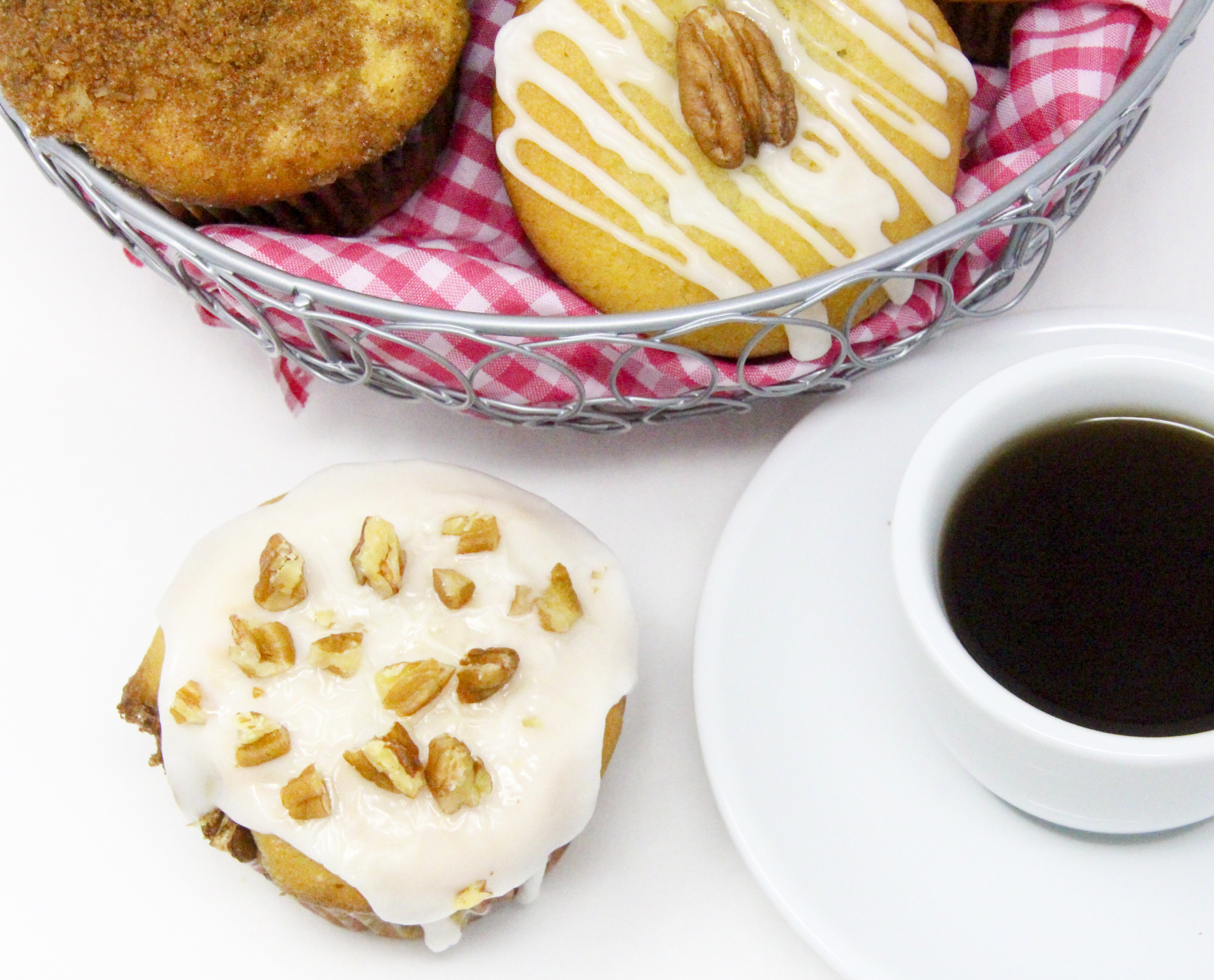 Sour Cream Pecan Coffee Cake Muffins are rich and tender, thanks to a generous amount of sour cream, while the addition of brown sugar, cinnamon, and pecans layered in the center of the muffins make these extra delicious. Recipe shared with permission granted by S.C. Perkins, author of FATAL FAMILY TIES.