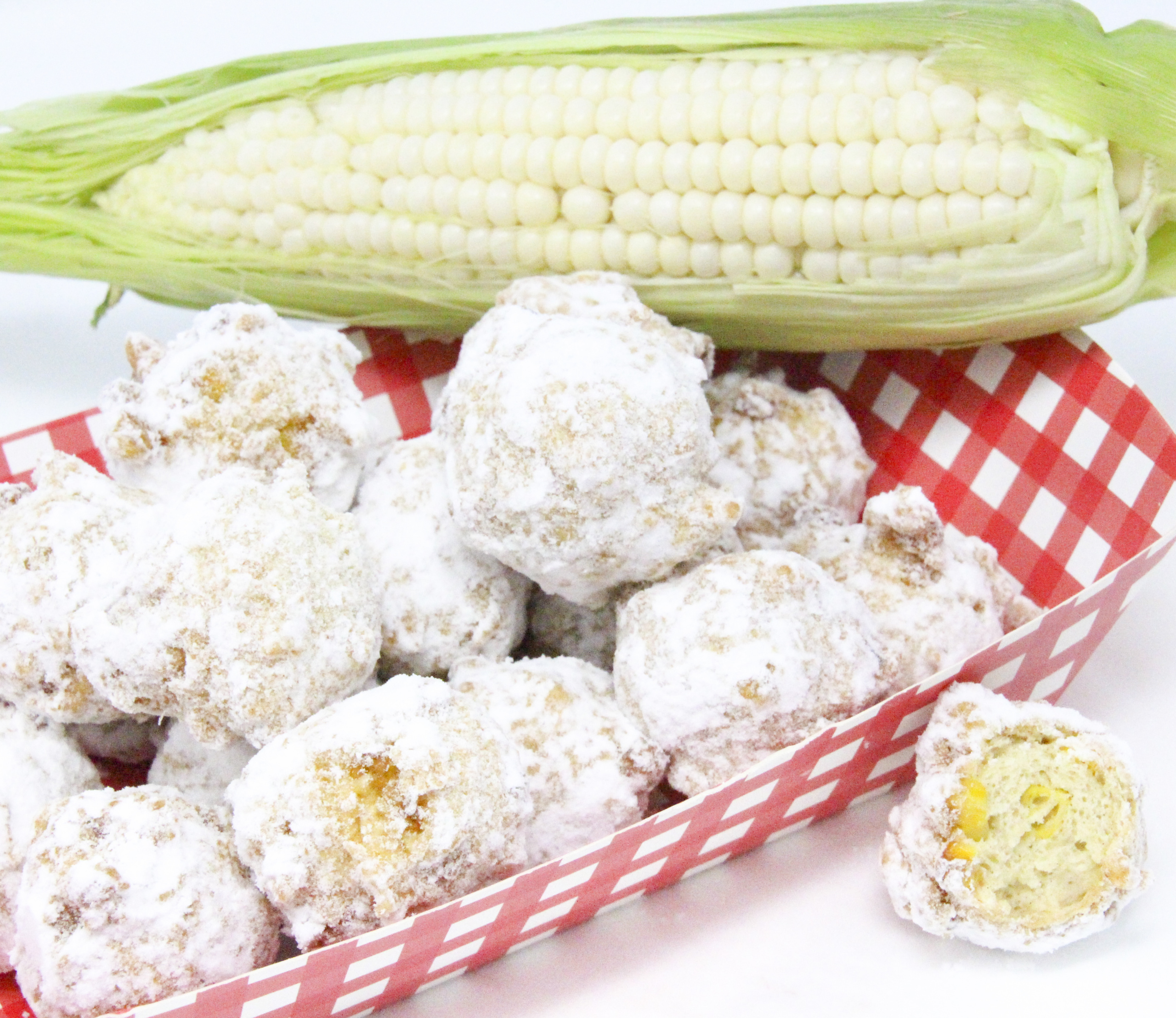 Corny Fritters can be served savory, spicy, or sweet depending on individual tastes. Fairly simple using canned or frozen corn, and a few other pantry and dairy staples, these delicious bites are quick to make. Recipe shared with permission granted by Ginger Bolton, author of BEYOND A REASONABLE DONUT. 