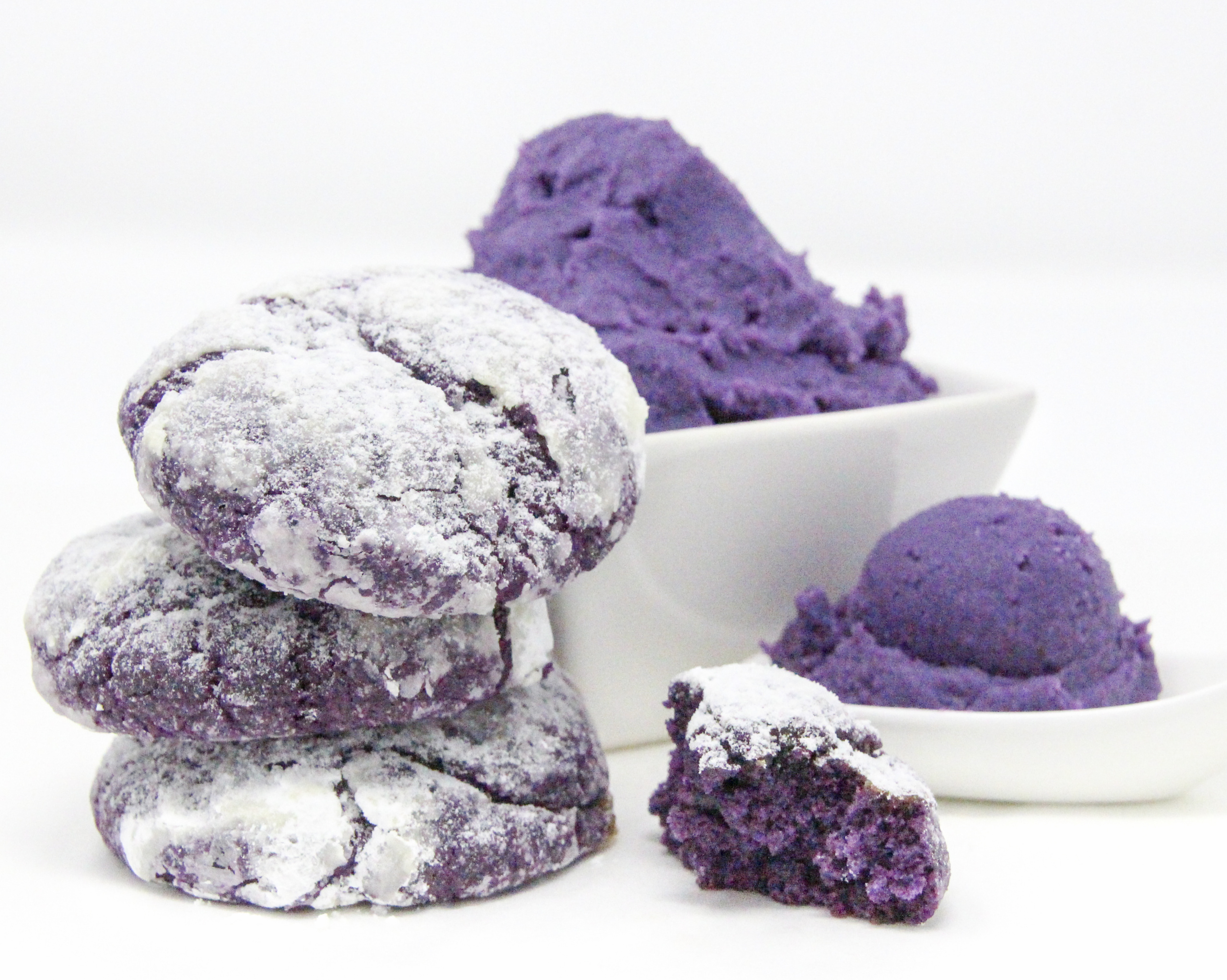 Traditional Filipino Ube Crinkles are delicious as they are unique and provide a welcome splash of color on any springtime cookie platter! Recipe shared with permission granted by Berkley Publishing, from cozy mystery ARSENIC AND ADOBO by Mia P. Manansala.