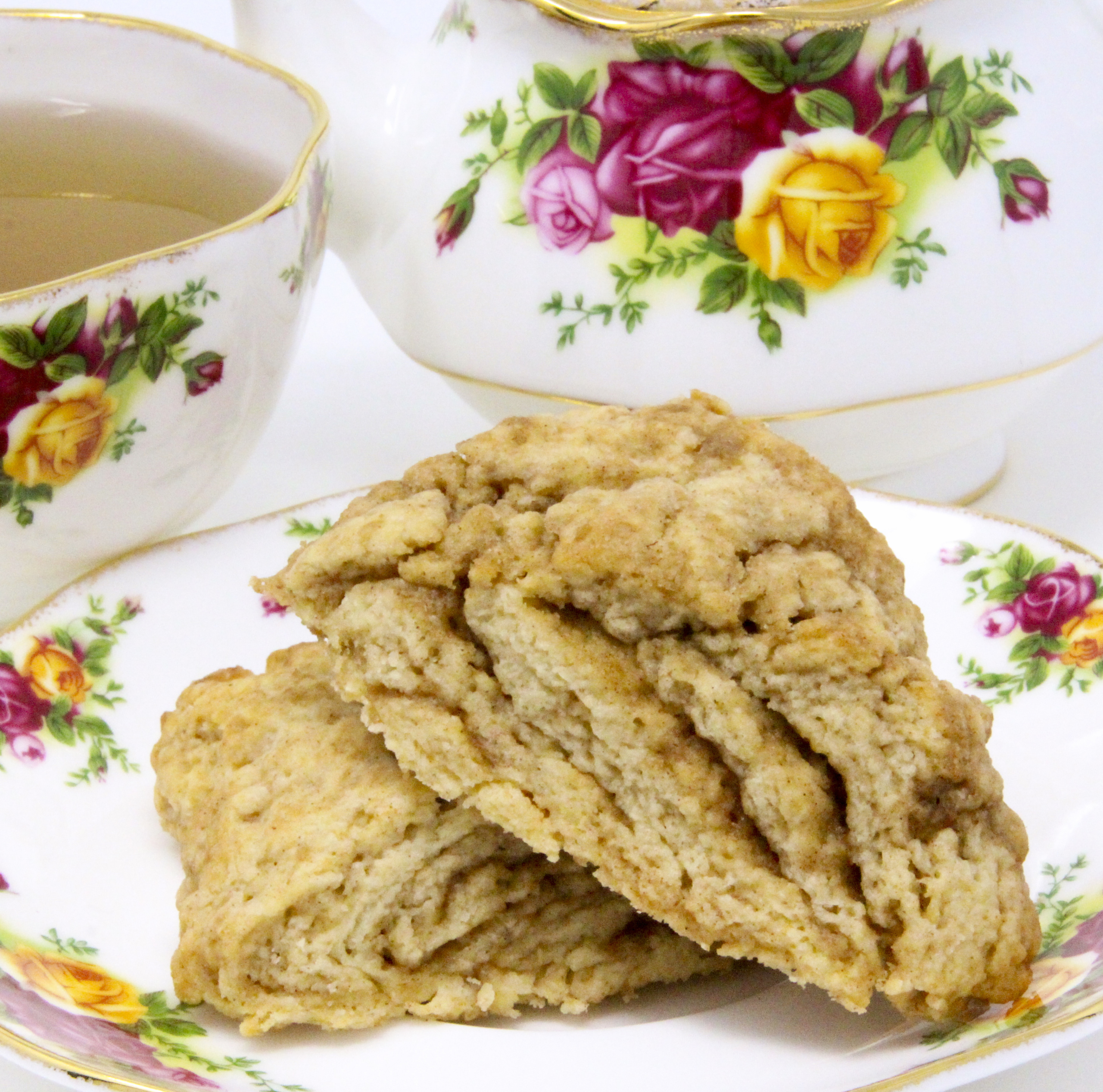 These melt-in-your-mouth flaky Cinnamon Swirl Scones are chock full of flavor thanks to a generous amount of cinnamon and brown sugar. Recipe shared with permission granted by Daryl Wood Gerber, author of A GLIMMER OF A CLUE.