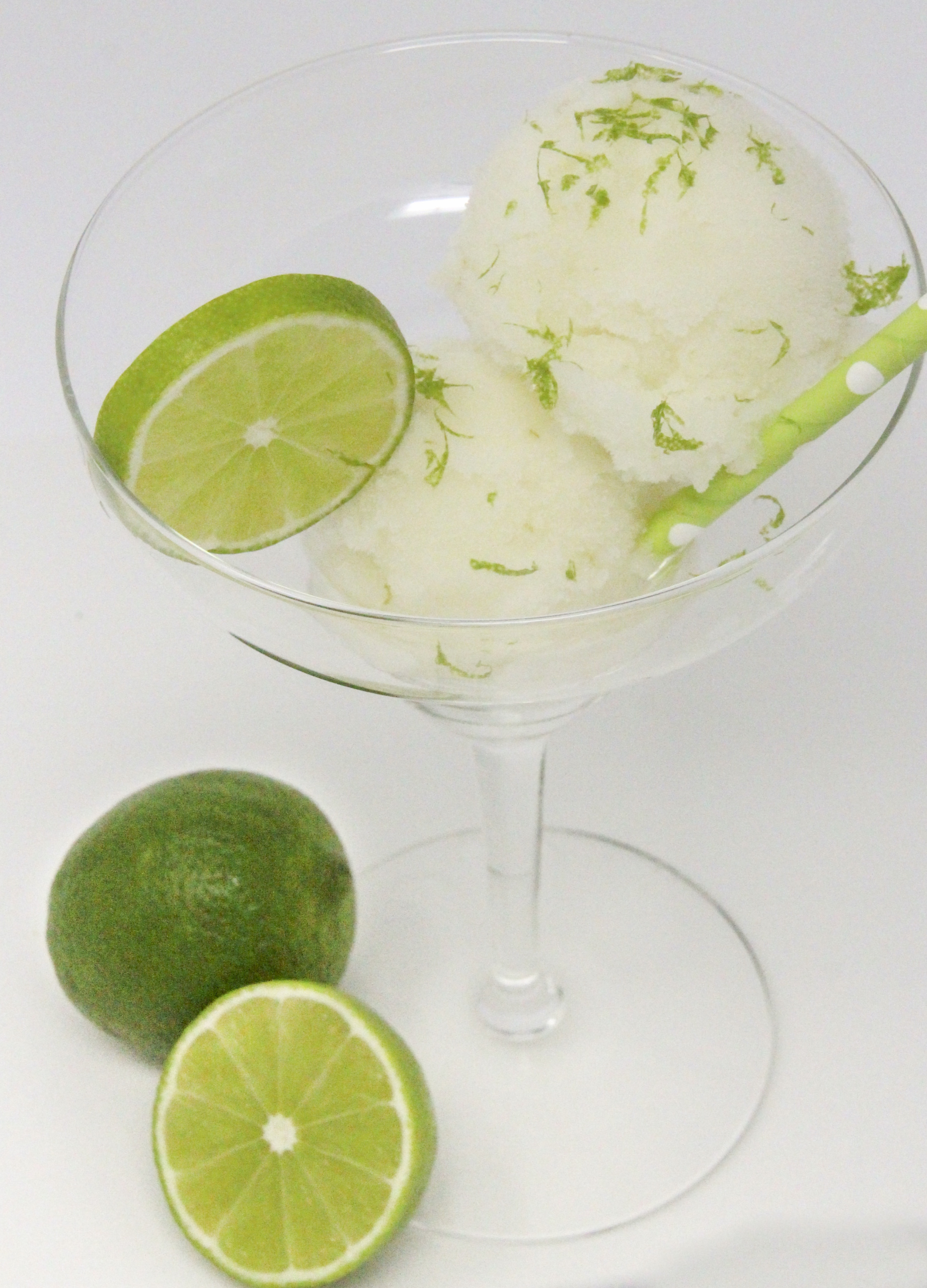 A tart-sweet lime sorbet with a kick from tequila and triple sec, this Ultimate Frozen Margarita captures the essence of summer! Recipe shared with permission granted by Meri Allan, author of THE ROCKY ROAD TO RUIN. 