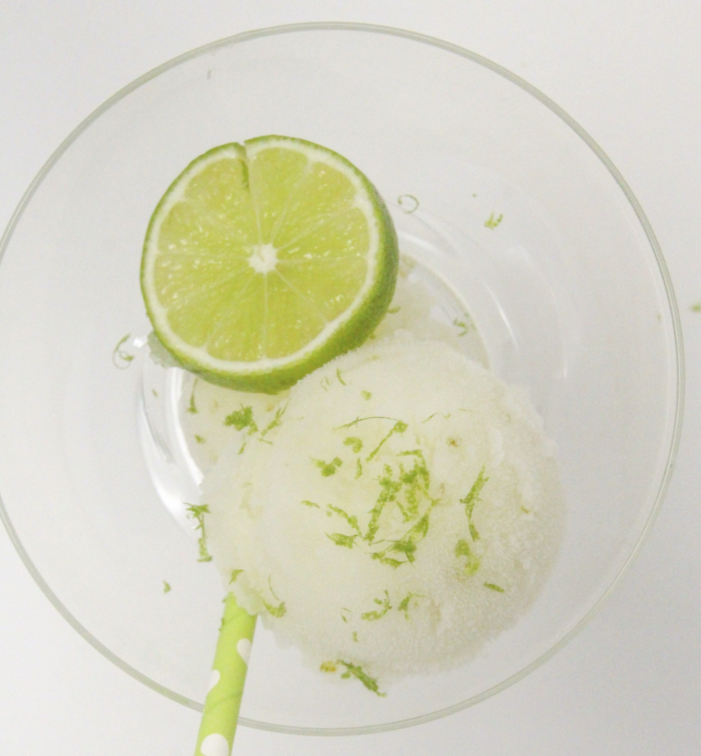 A tart-sweet lime sorbet with a kick from tequila and triple sec, this Ultimate Frozen Margarita captures the essence of summer! Recipe shared with permission granted by Meri Allan, author of THE ROCKY ROAD TO RUIN. 